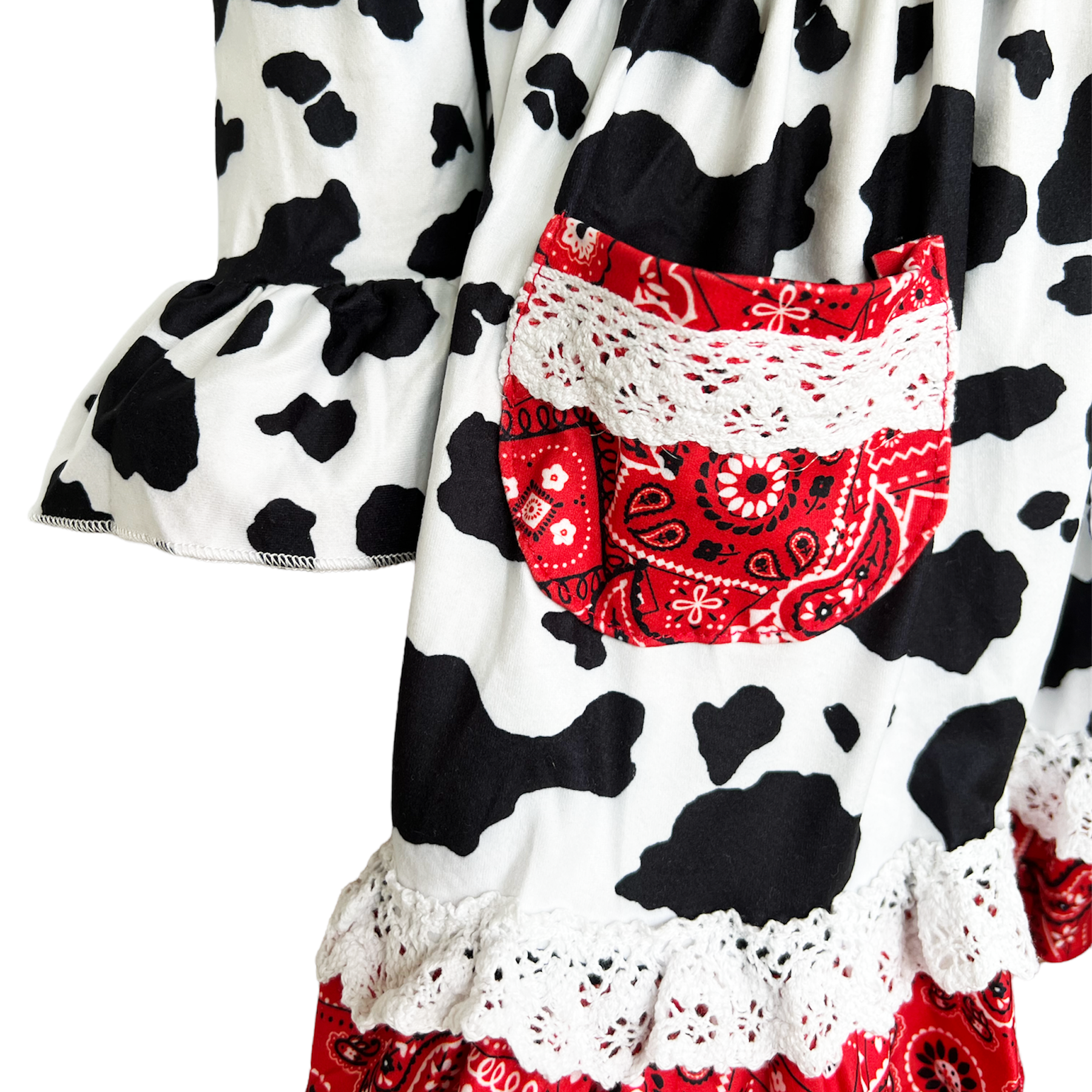 AL Limited Girls Boutique Cowgirl Dress featuring playful cow print and red bandana trimming with white eyelet ruffle accents.