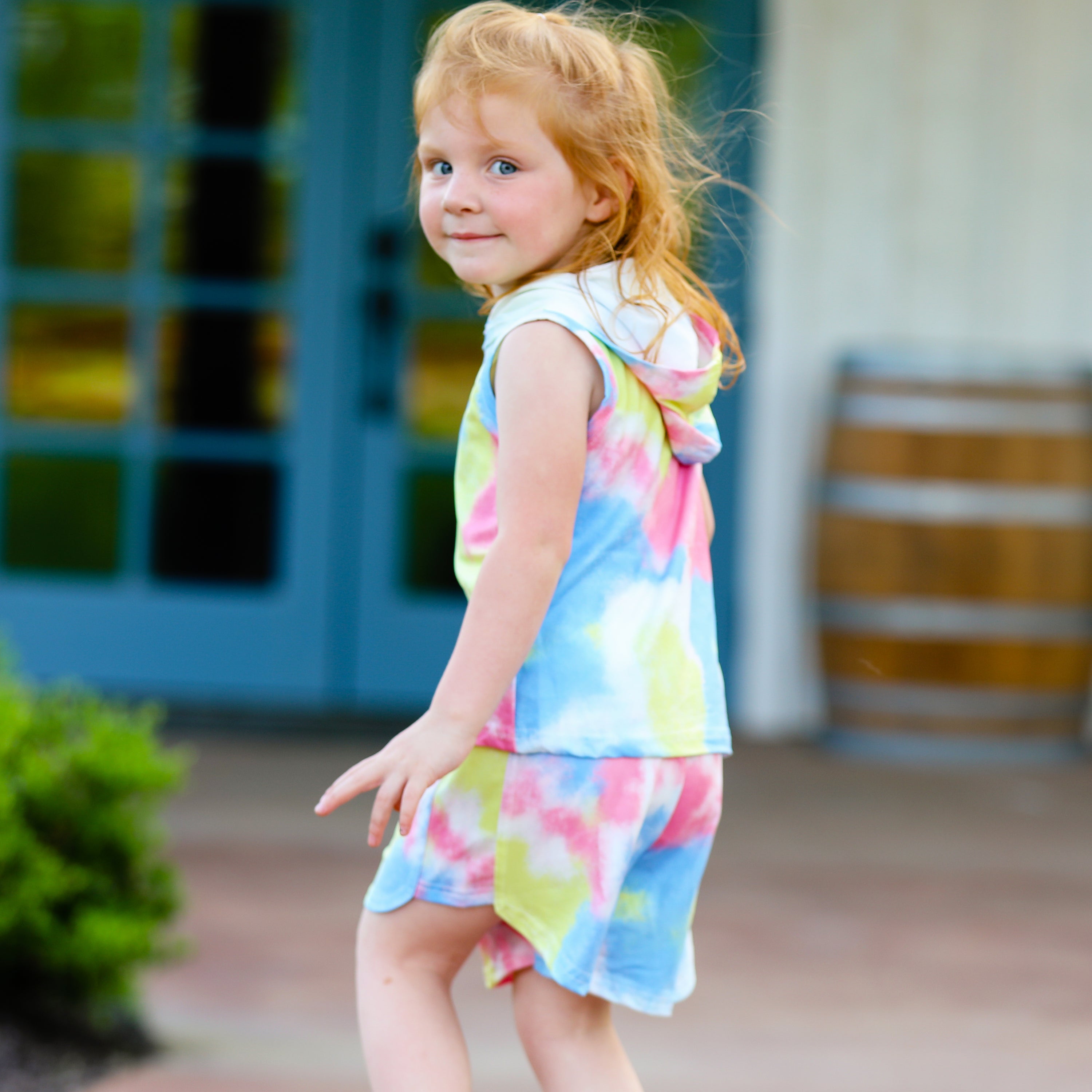 AL Limited pastel tie dye hoodie top and shorts set for girls, featuring vibrant yellow, pink, and blue colors, perfect for summer activities.