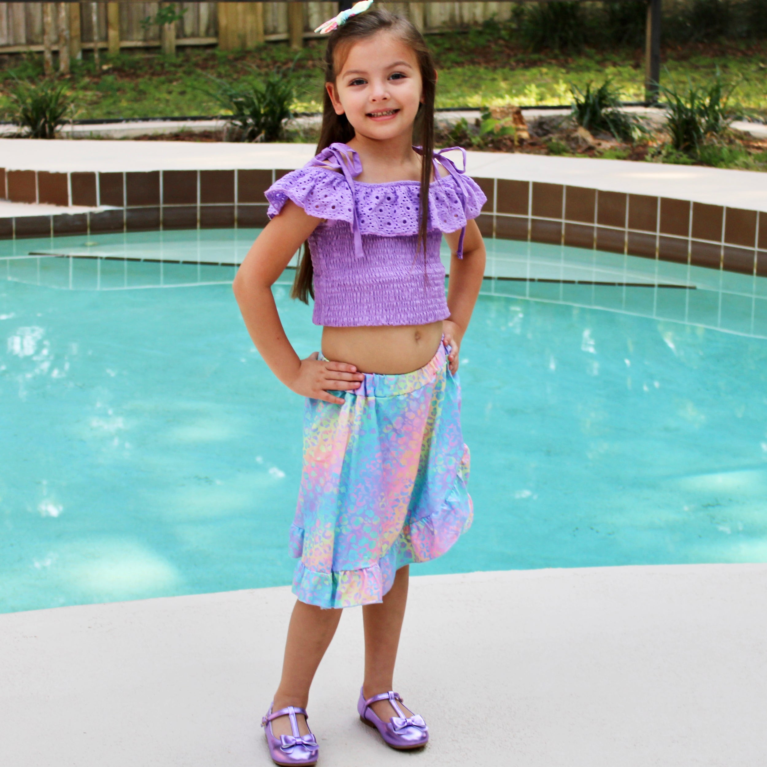 AL Limited Little & Big Girls Purple Eyelet Smocked Top with Tie Dye Skirt, showcasing vibrant colors and stylish design.