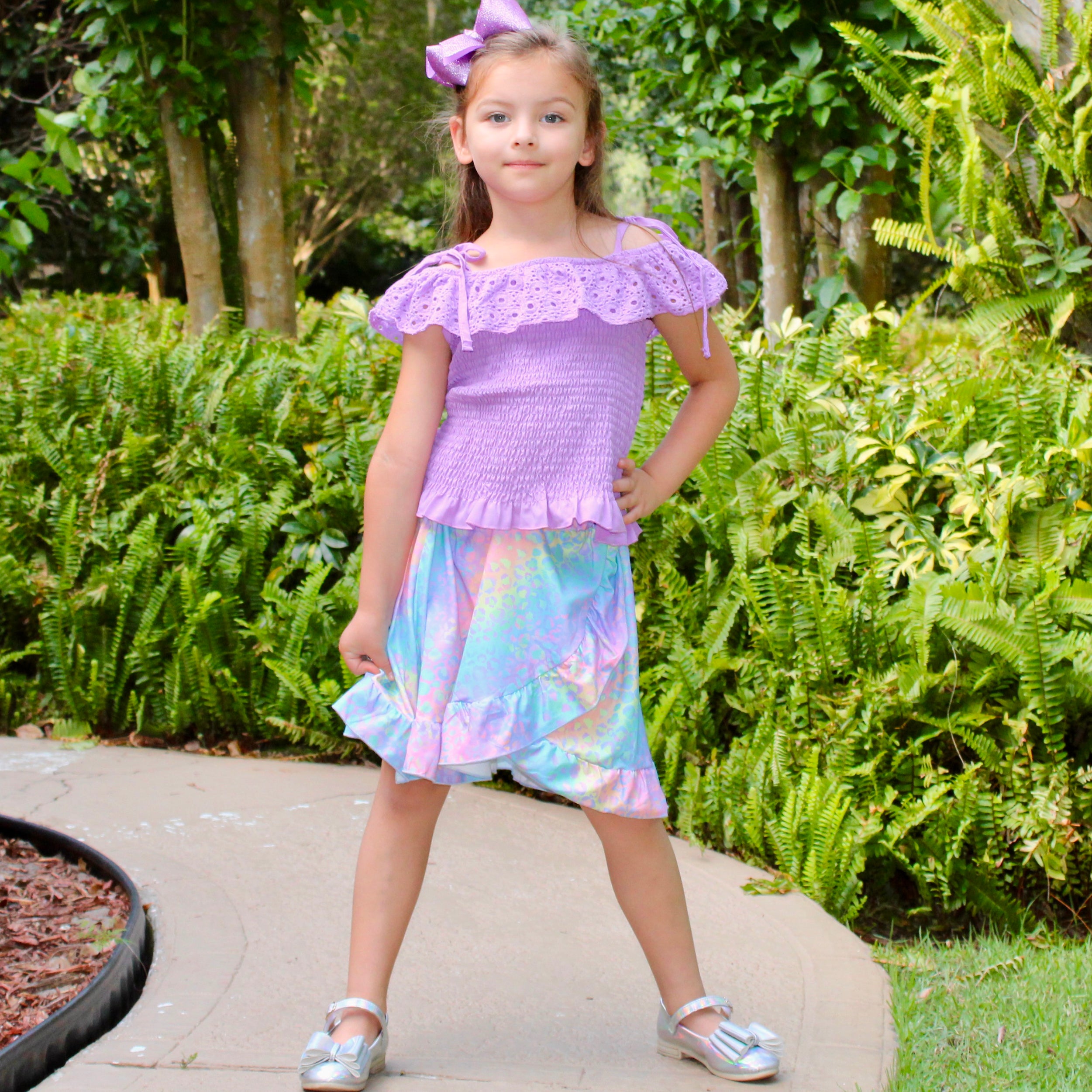 AL Limited Little & Big Girls Purple Eyelet Smocked Top with Tie Dye Skirt, showcasing vibrant colors and stylish design.