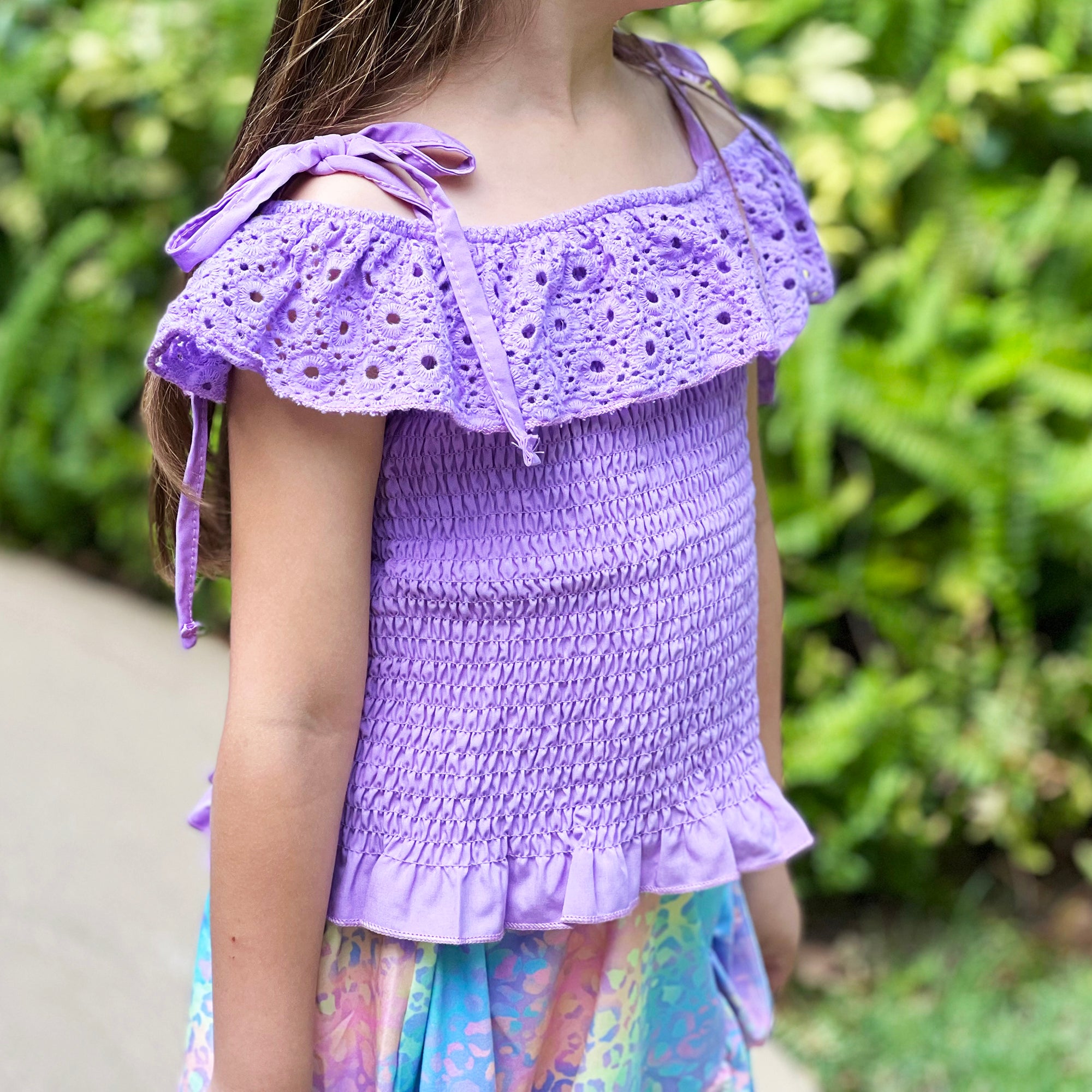 AL Limited Little & Big Girls Purple Eyelet Smocked Top with Tie Dye Skirt, showcasing vibrant colors and stylish design.