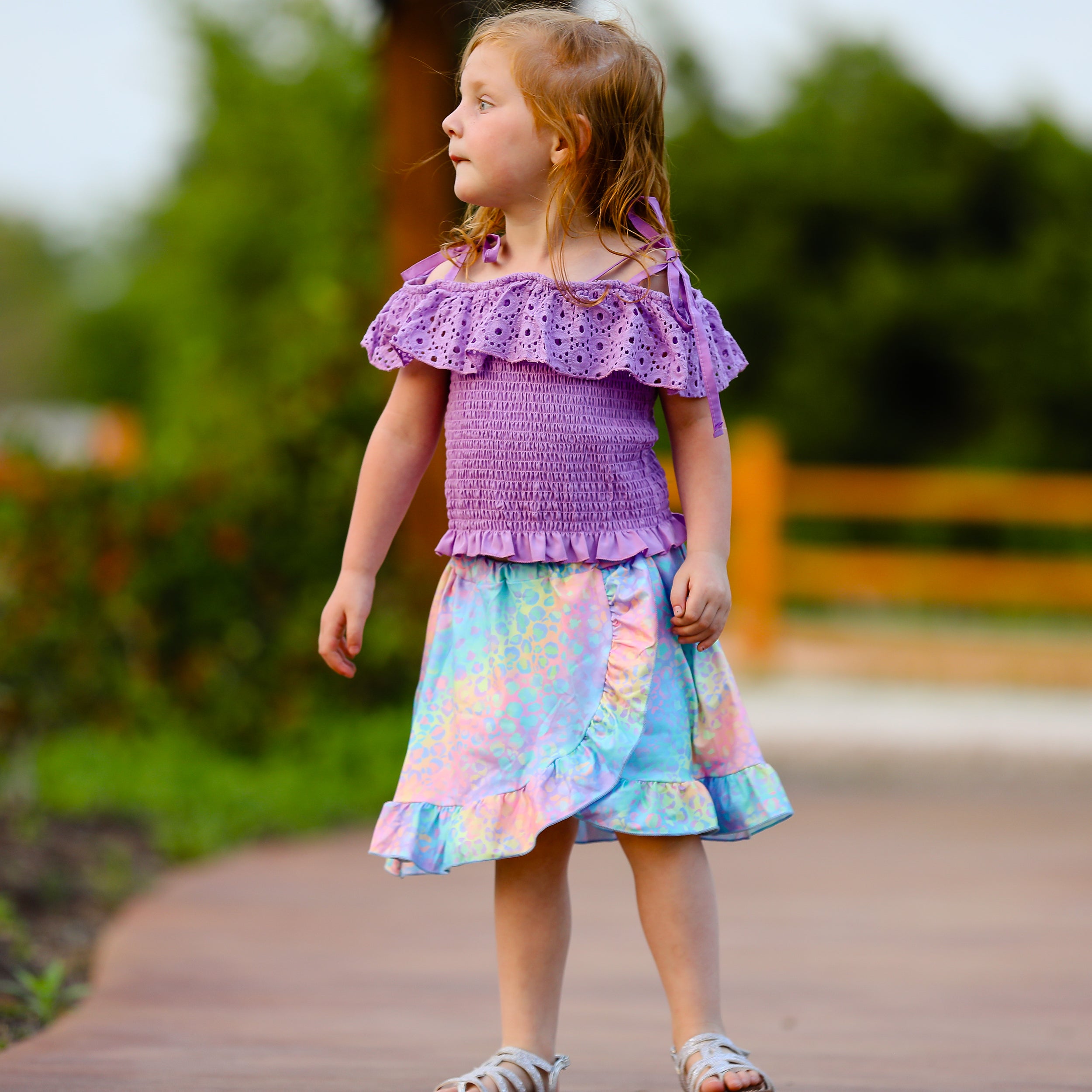 AL Limited Little & Big Girls Purple Eyelet Smocked Top with Tie Dye Skirt, showcasing vibrant colors and stylish design.