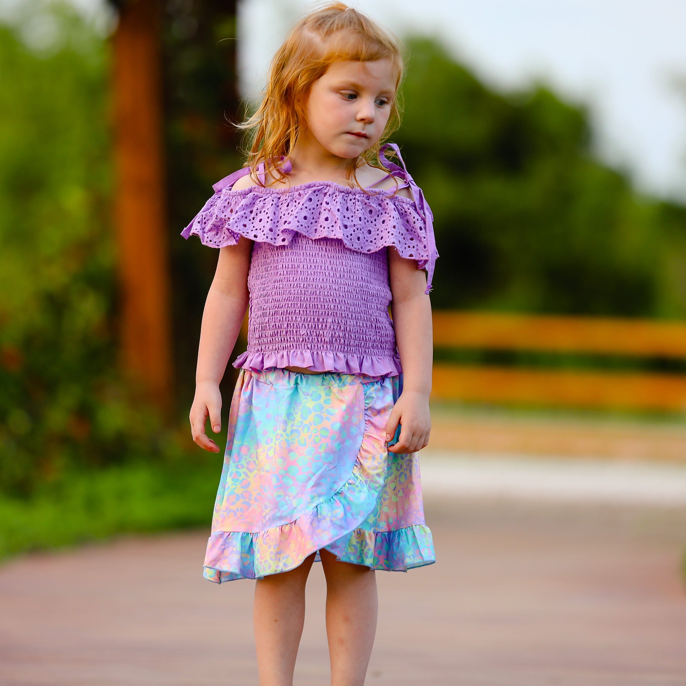 AL Limited Little & Big Girls Purple Eyelet Smocked Top with Tie Dye Skirt, showcasing vibrant colors and stylish design.