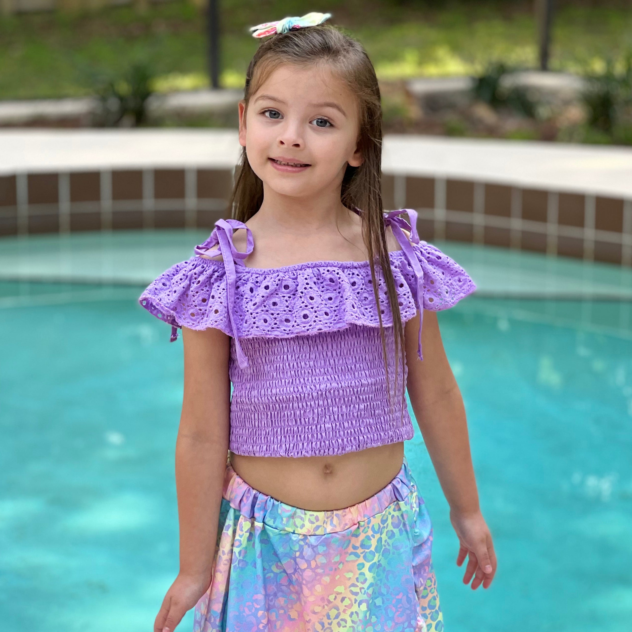 AL Limited Little & Big Girls Purple Eyelet Smocked Top with Tie Dye Skirt, showcasing vibrant colors and stylish design.