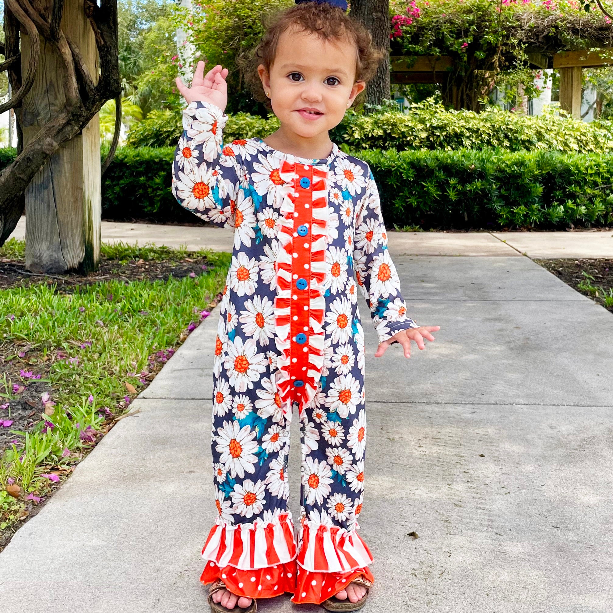 AL Limited Orange Daisy Floral Baby Girls Long Sleeve Tuxedo Lace romper featuring ruffle details and snap closures.