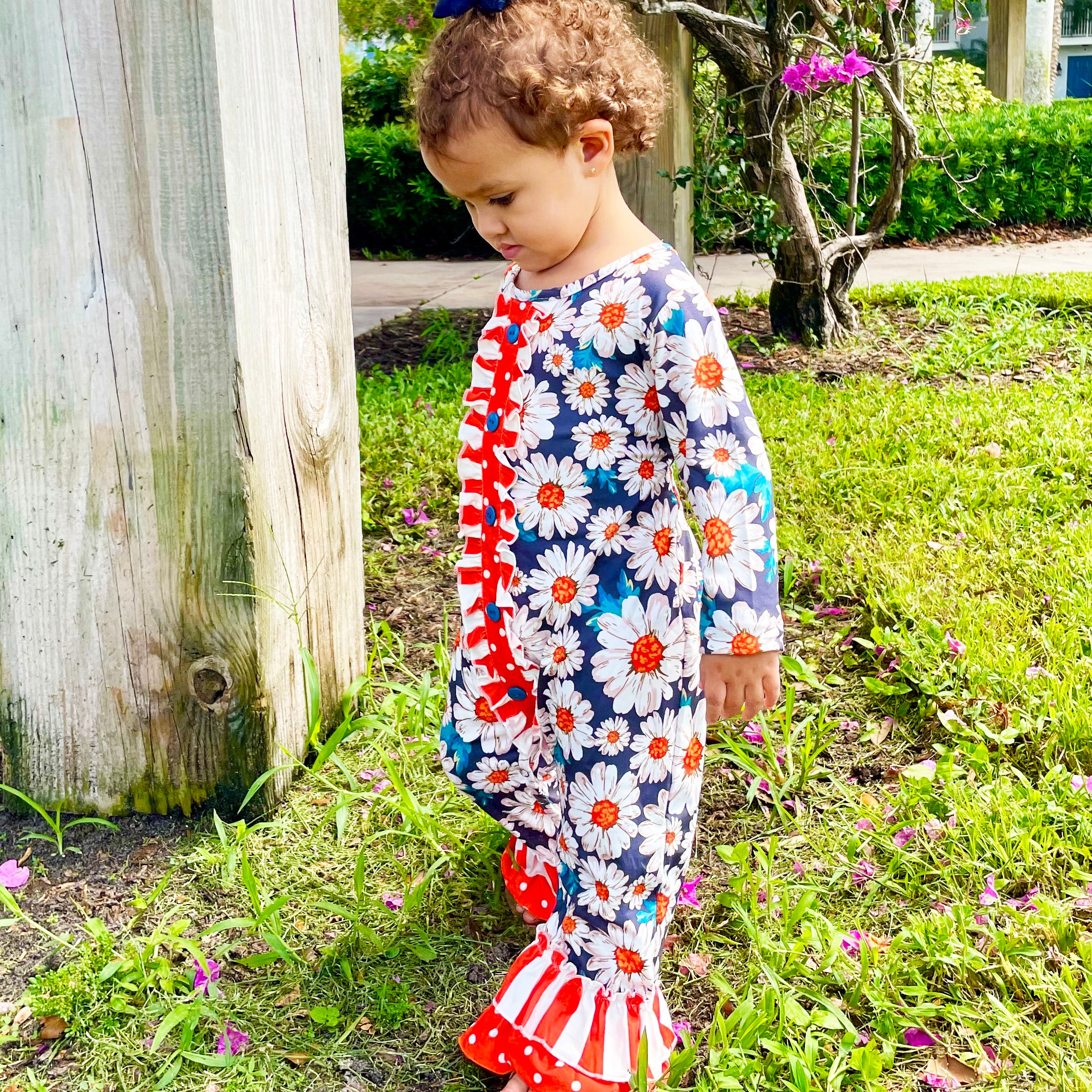 AL Limited Orange Daisy Floral Baby Girls Long Sleeve Tuxedo Lace romper featuring ruffle details and snap closures.