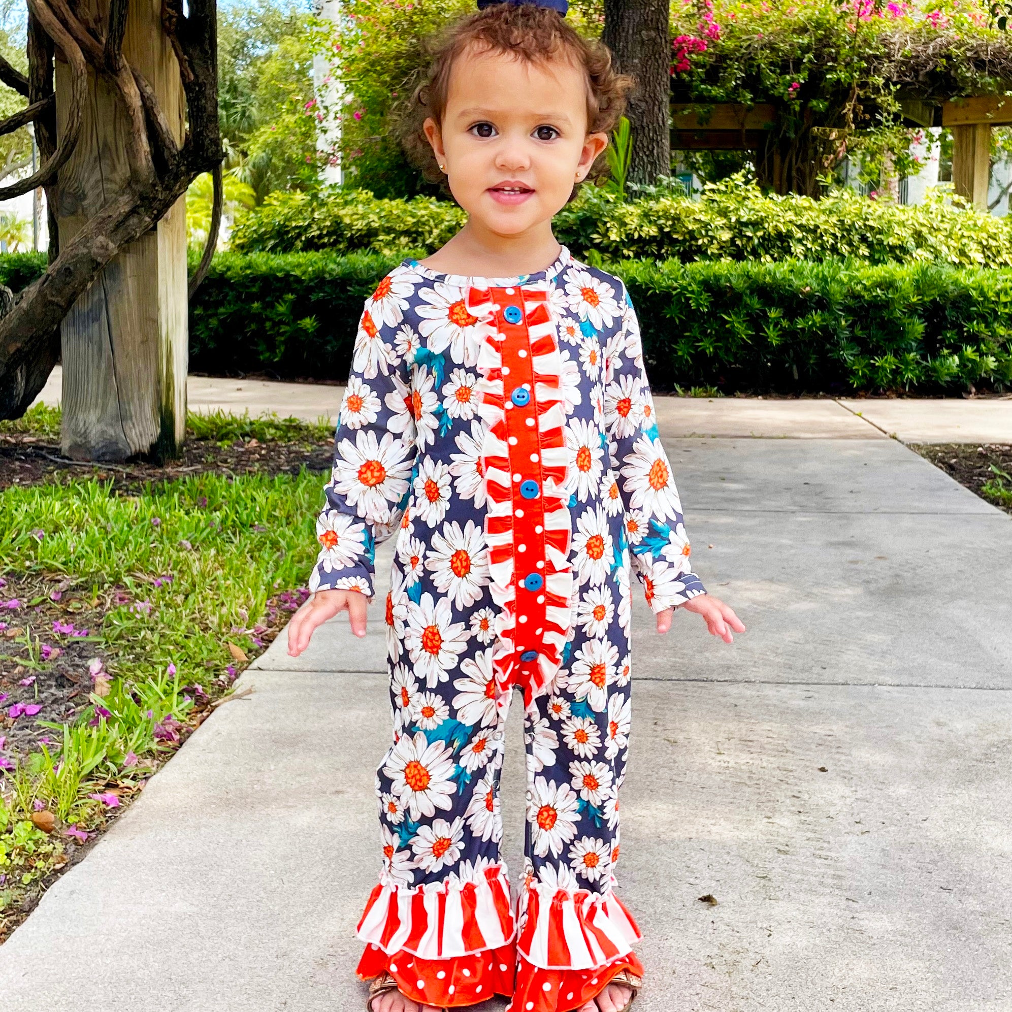 AL Limited Orange Daisy Floral Baby Girls Long Sleeve Tuxedo Lace romper featuring ruffle details and snap closures.