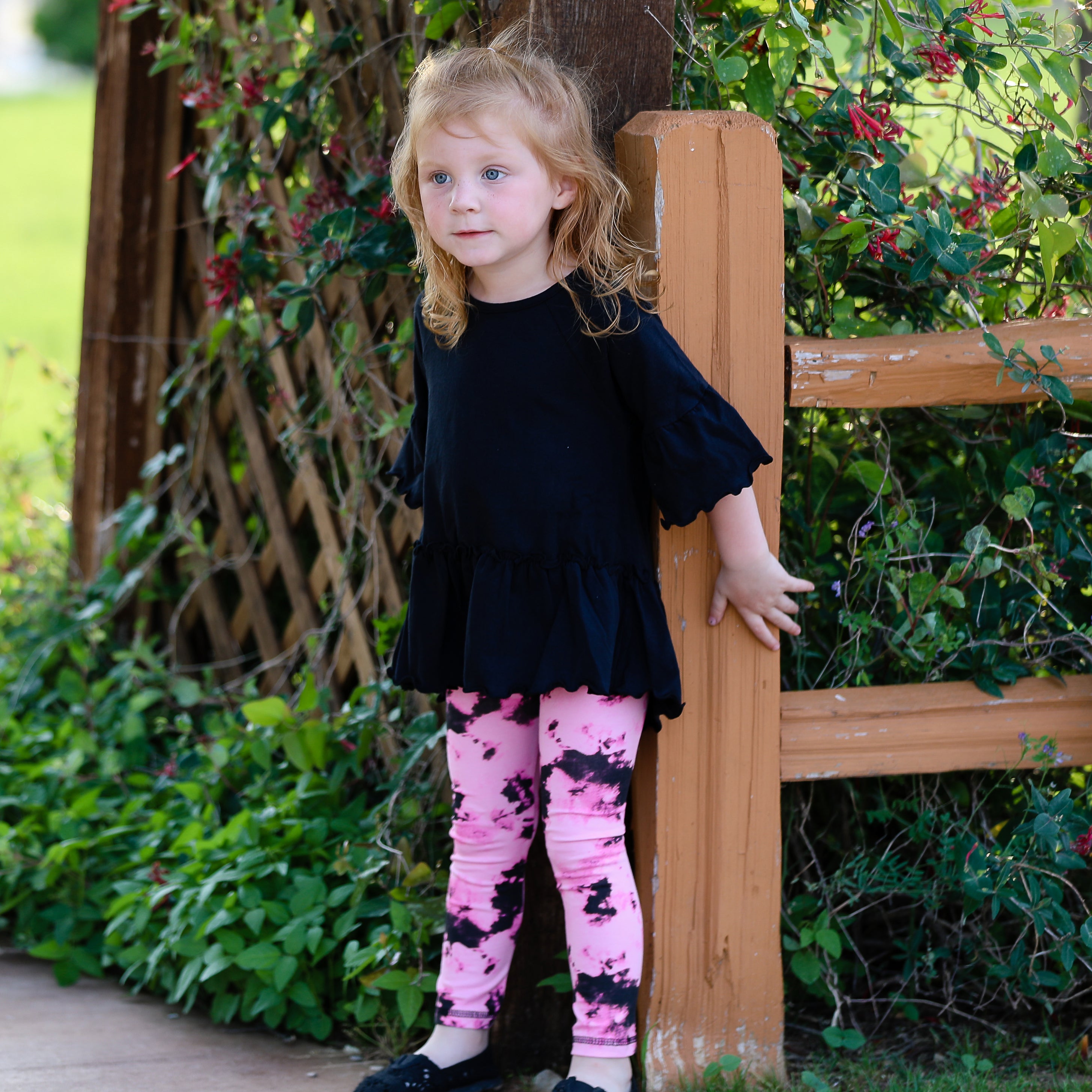 AnnLoren Baby Toddler Big Girls Boutique leggings featuring vibrant pink and black tie dye design with ruffles and thick elastic waistband.