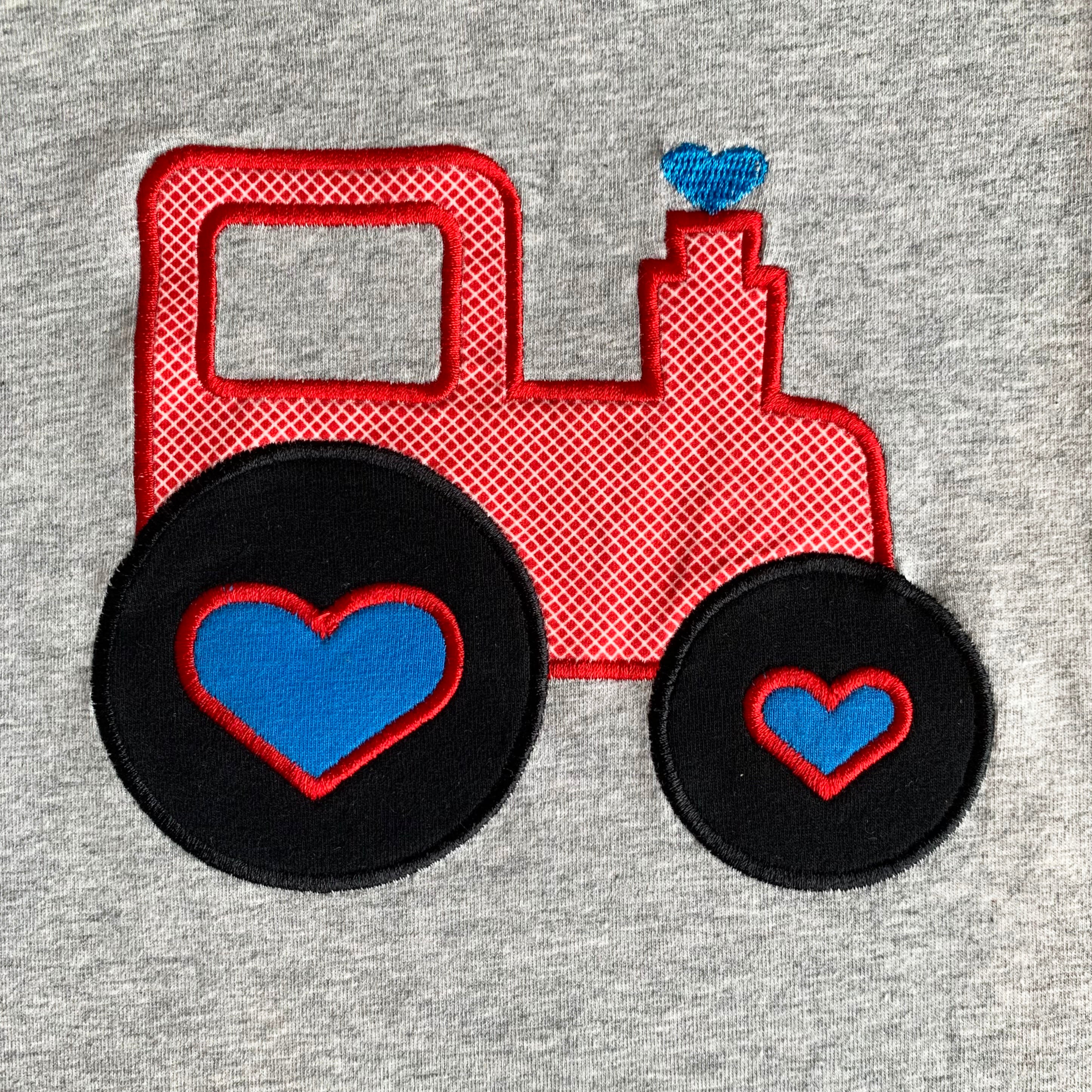 AnnLoren Baby Toddler Boys Long Sleeve Truck Romper in blue and grey with red truck appliqué and knee patches.