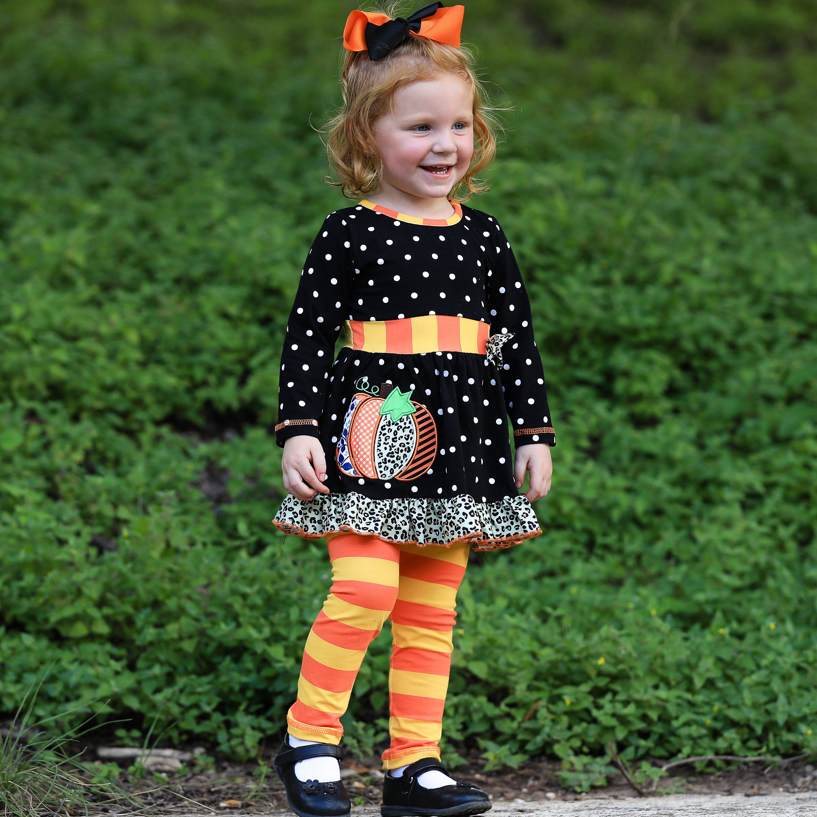 AnnLoren Girls Autumn Dress featuring black polka dots, orange pumpkin embroidery, and matching orange striped leggings with elastic waistband.