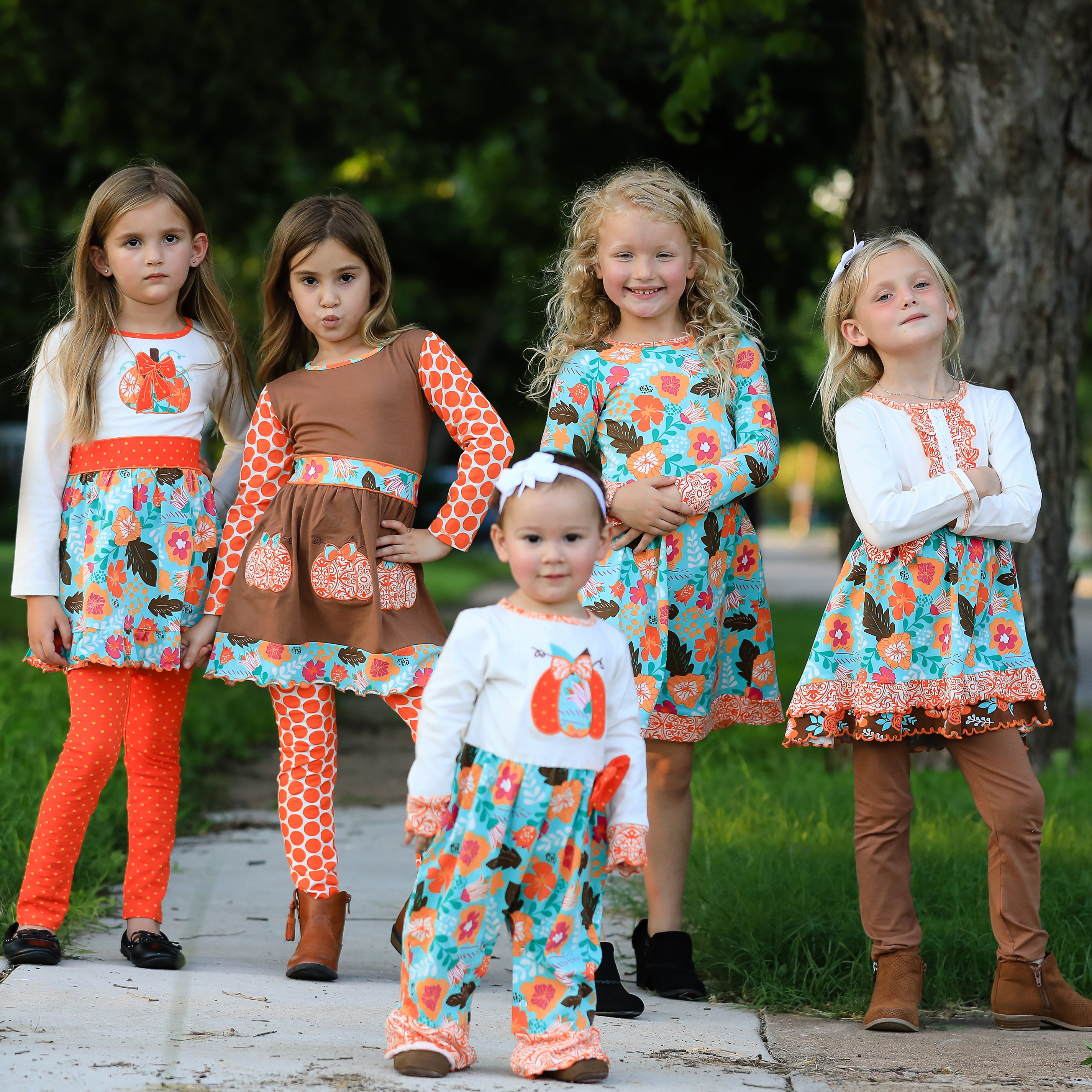 AnnLoren Girls Holiday Autumn Floral Ruffle Dress featuring cream long sleeves, orange damask ruffle, and brown leggings.