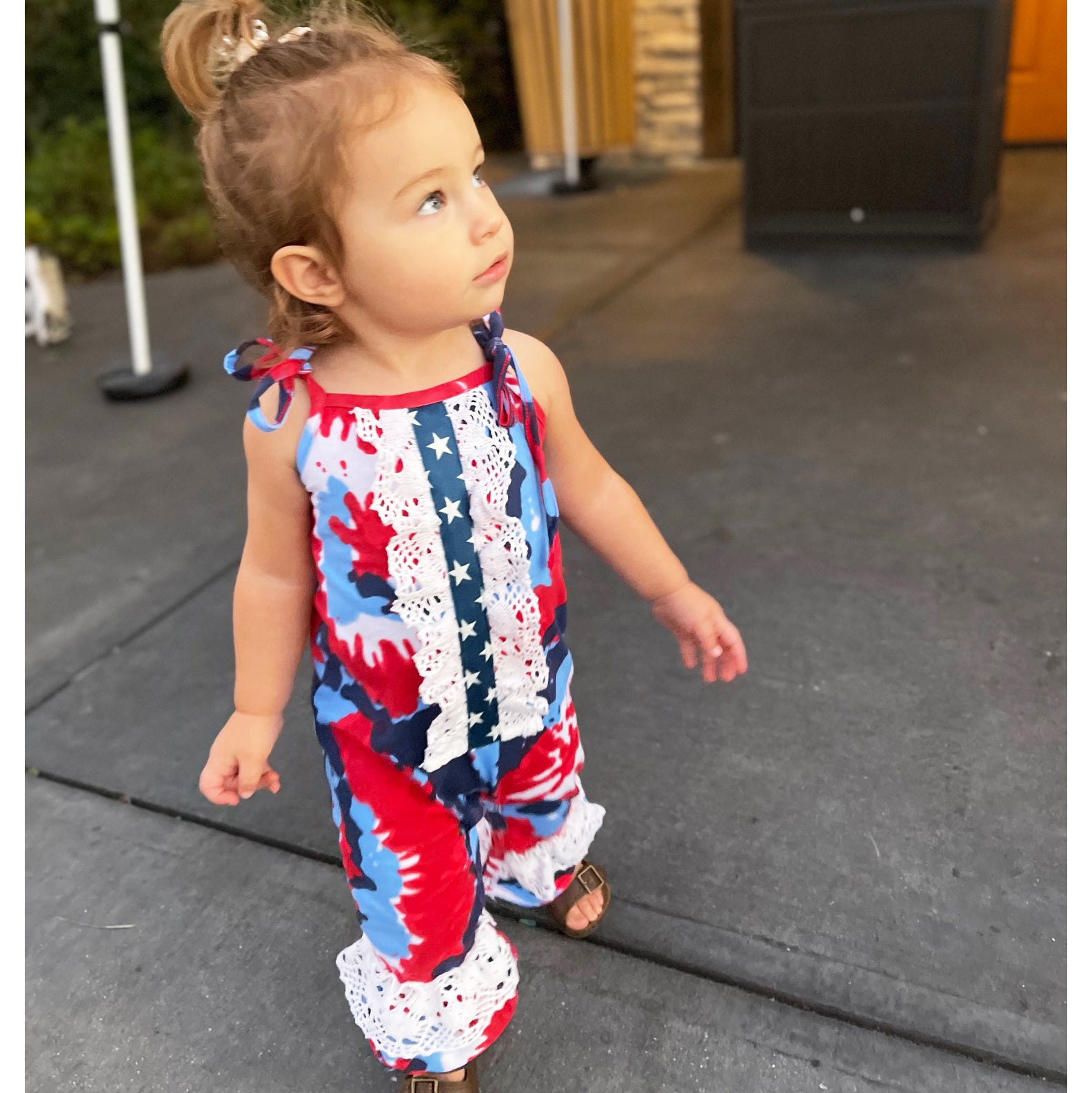 AnnLoren Red, White & Blue Tie Dye Baby Girls Romper featuring spaghetti straps, eyelet trim, and snap closures, perfect for summer celebrations.