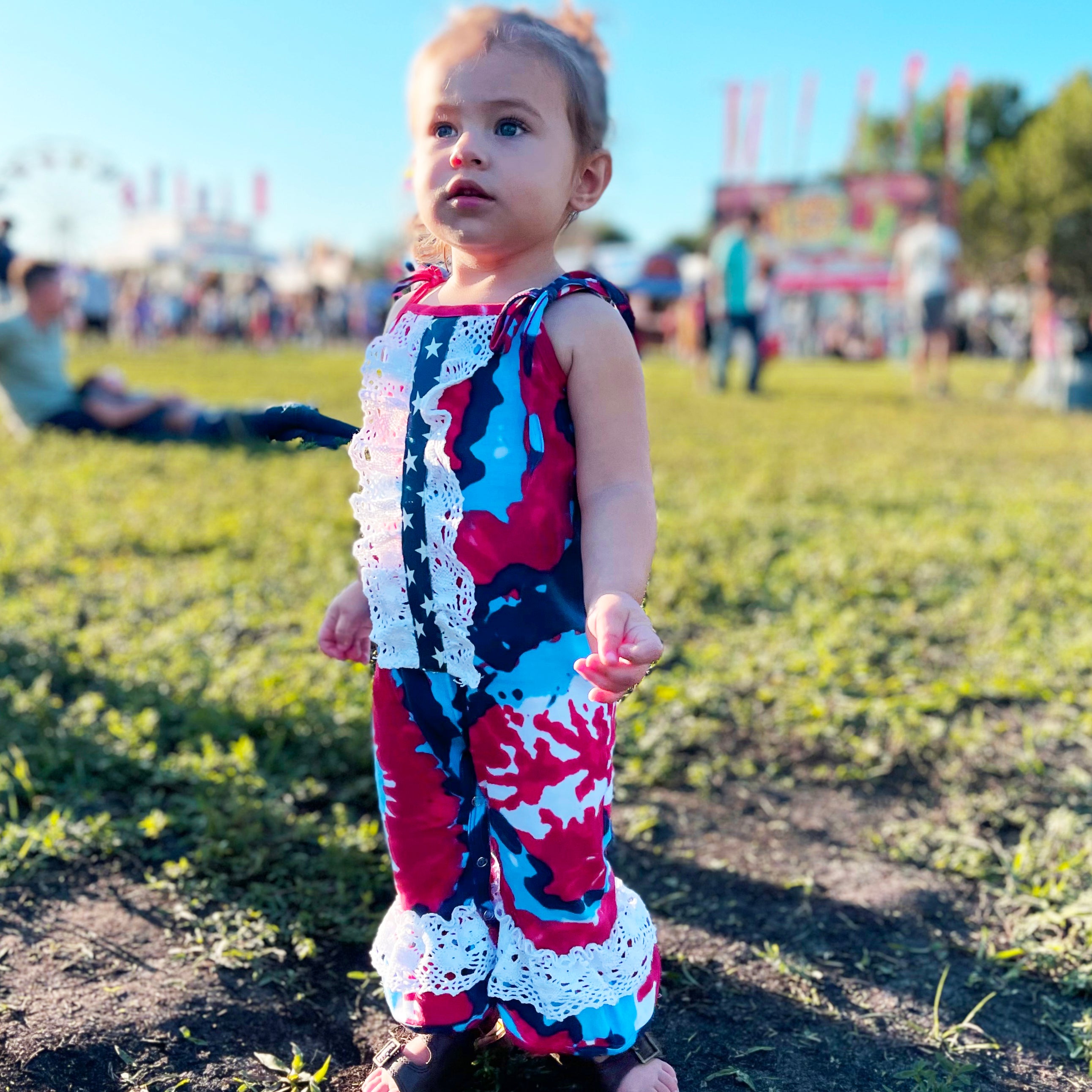 AnnLoren Red, White & Blue Tie Dye Baby Girls Romper featuring spaghetti straps, eyelet trim, and snap closures, perfect for summer celebrations.