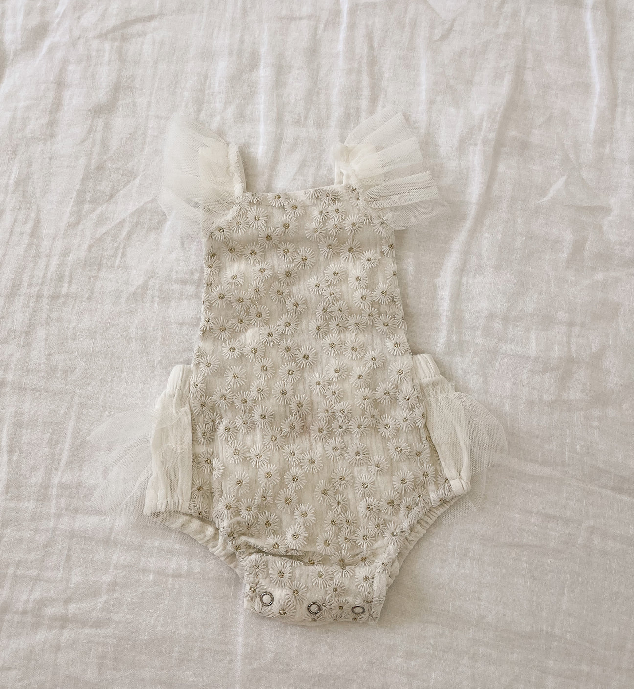 Aria Lace Romper featuring soft cotton fabric and elegant lace detailing, perfect for stylish summer outings.