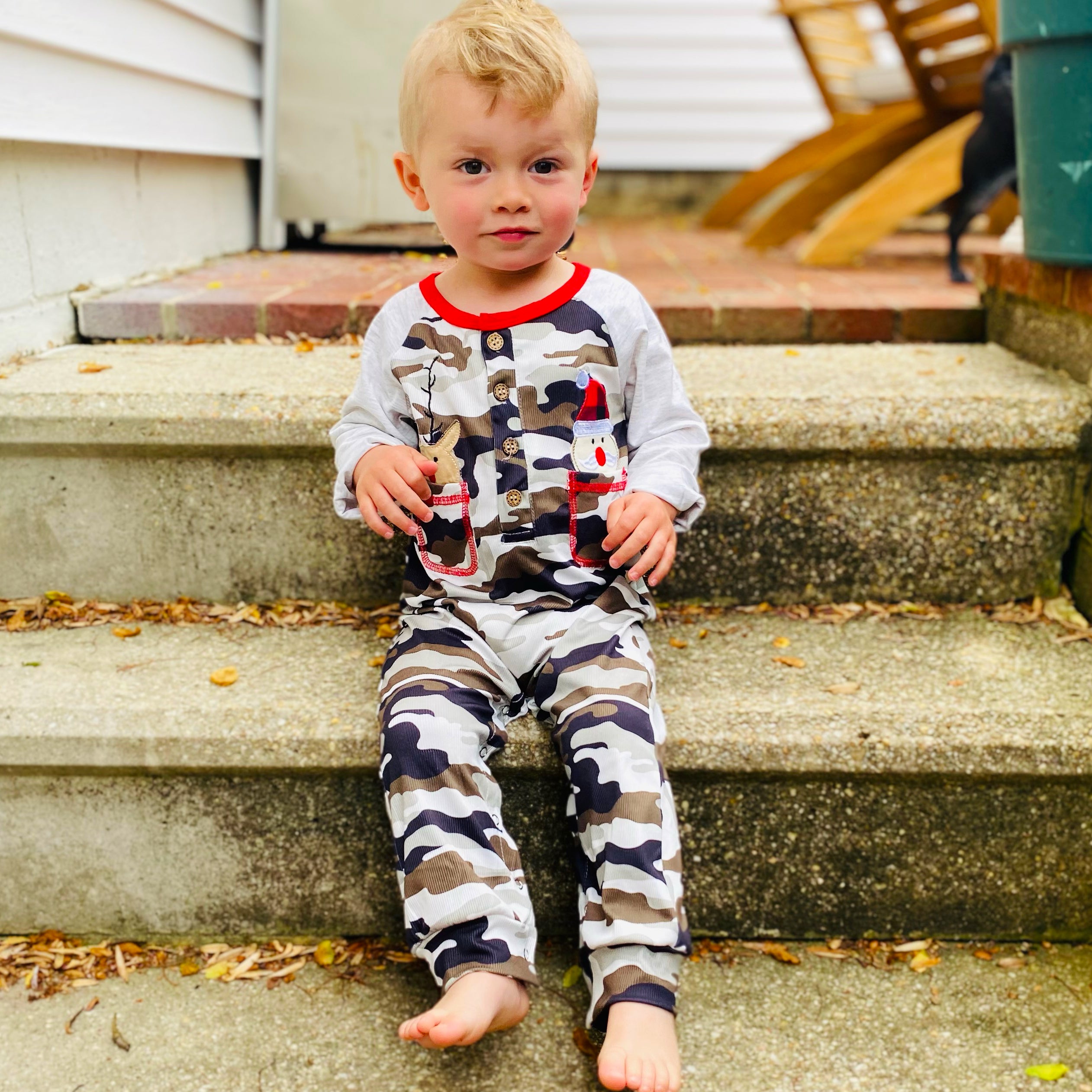 Baby boys camouflage romper featuring Santa and reindeer appliques, with grey sleeves and pockets, perfect for Christmas celebrations.