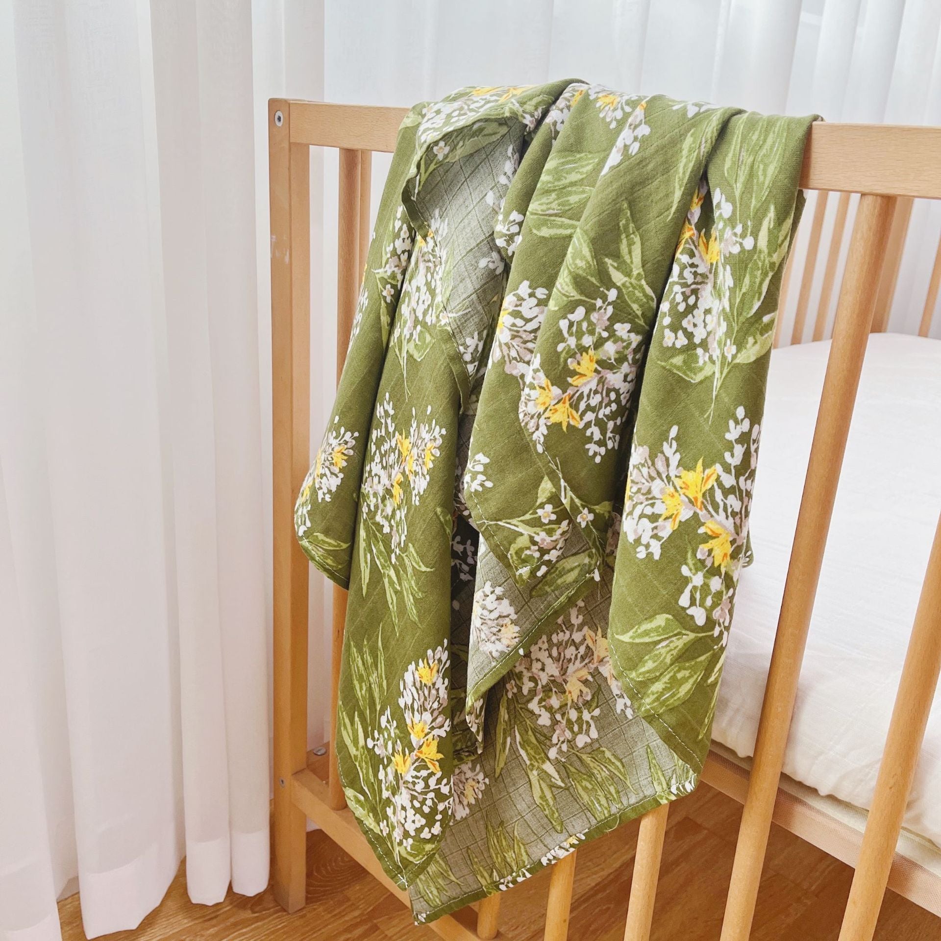 A soft and breathable Bamboo Swaddle made from 70% bamboo and 30% cotton, measuring 47" x 47", perfect for wrapping babies.