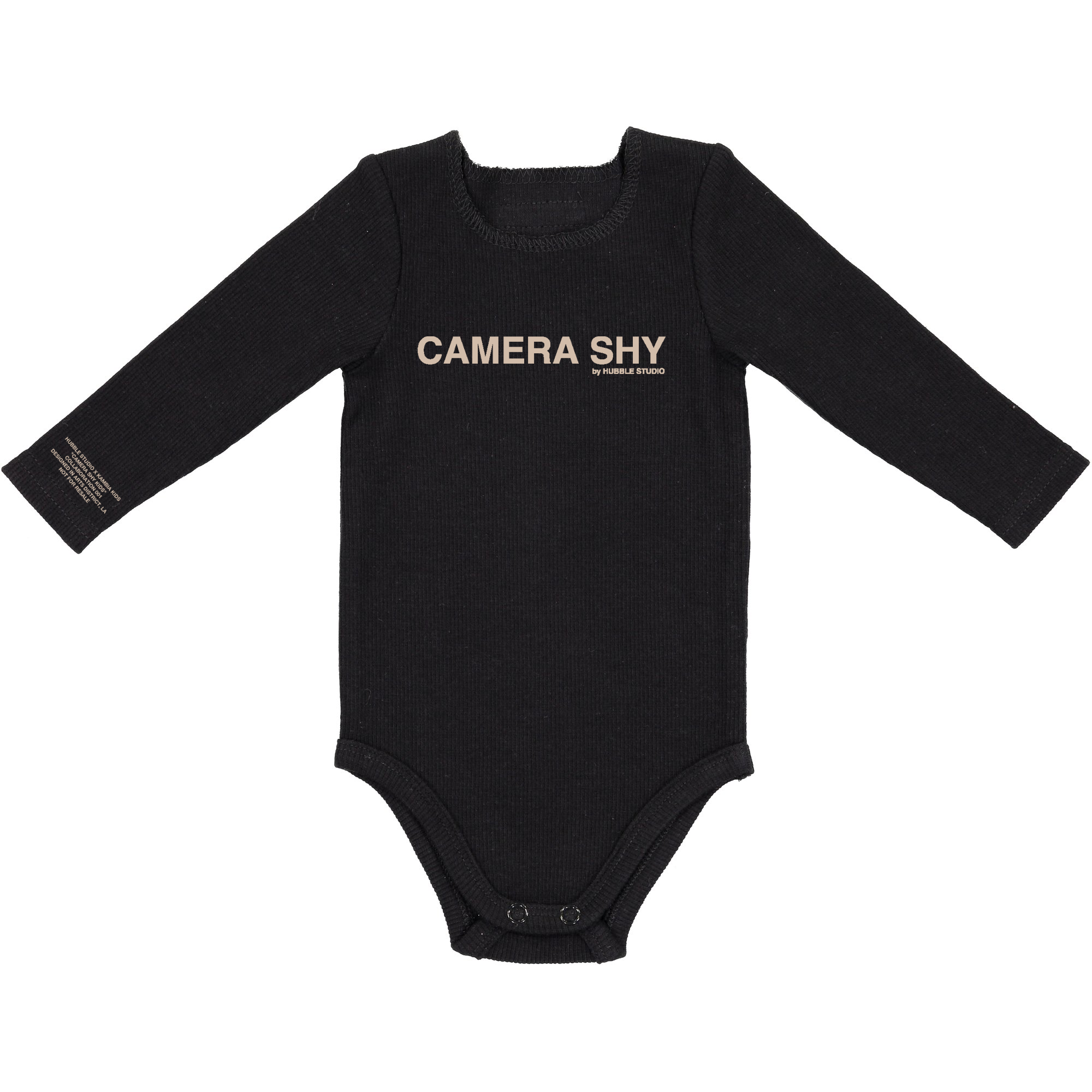 Black Camera Shy Onesie featuring a playful design for photogenic babies, made from organic cotton.