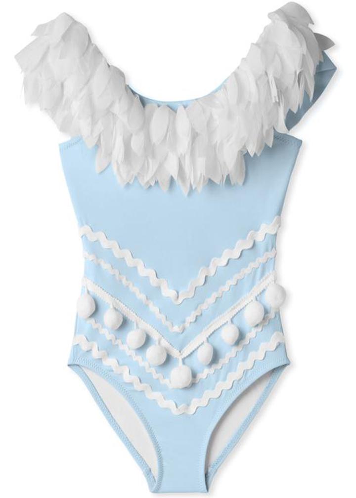 A stylish blue draped swimsuit for girls featuring chiffon petal details and playful pom poms, perfect for summer fun.