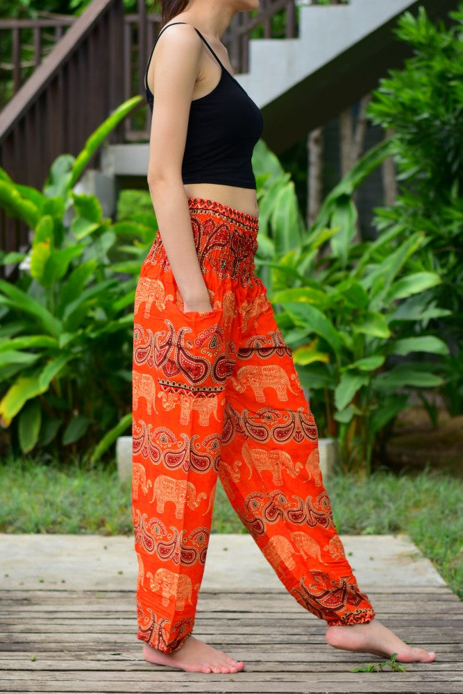 Bohotusk Kids Orange Elephant Harem Trousers with elasticated waist and ankles, featuring a vibrant elephant design.