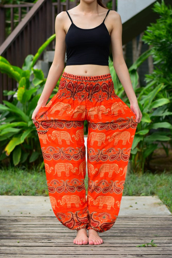 Bohotusk Kids Orange Elephant Harem Trousers with elasticated waist and ankles, featuring a vibrant elephant design.