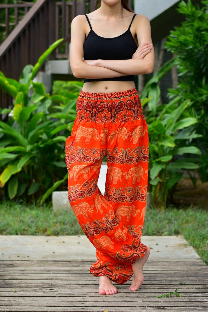 Bohotusk Kids Orange Elephant Harem Trousers with elasticated waist and ankles, featuring a vibrant elephant design.