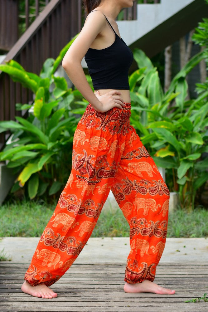 Bohotusk Kids Orange Elephant Harem Trousers with elasticated waist and ankles, featuring a vibrant elephant design.