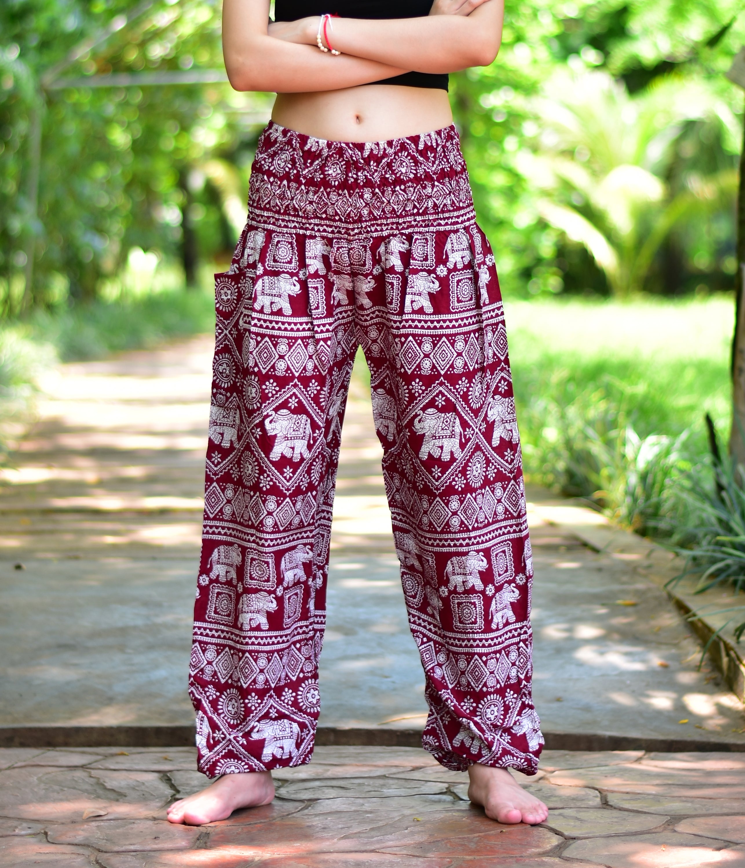 Bohotusk Kids Red Elephant Print Harem Pants featuring a vibrant design and elasticated waist, perfect for comfort and style.