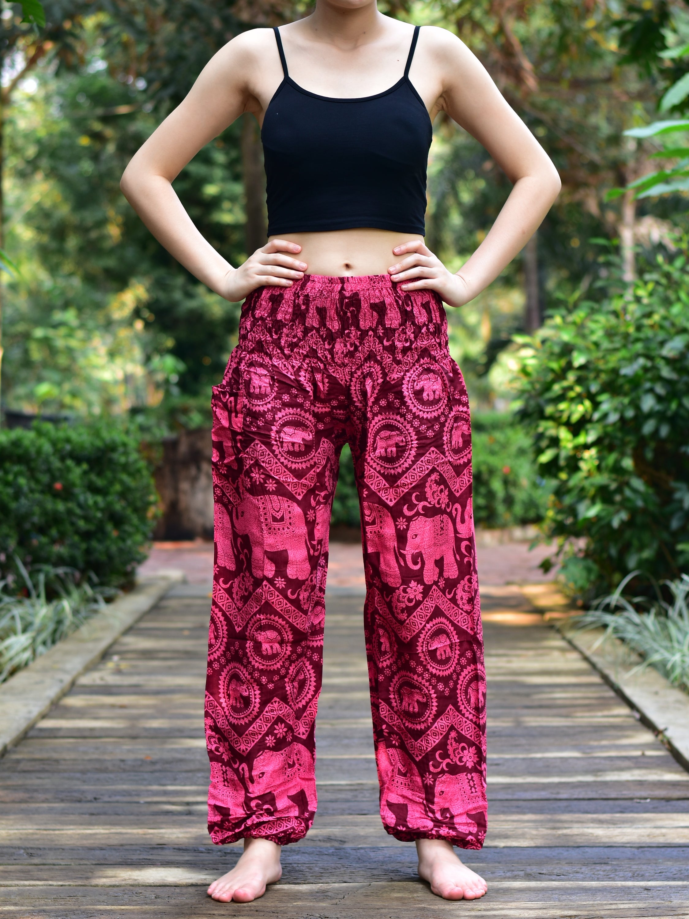 Bohotusk Kids Red Pink Elephant Harem Trousers featuring a vibrant elephant design, elasticated waist, and ankles, made from soft rayon.