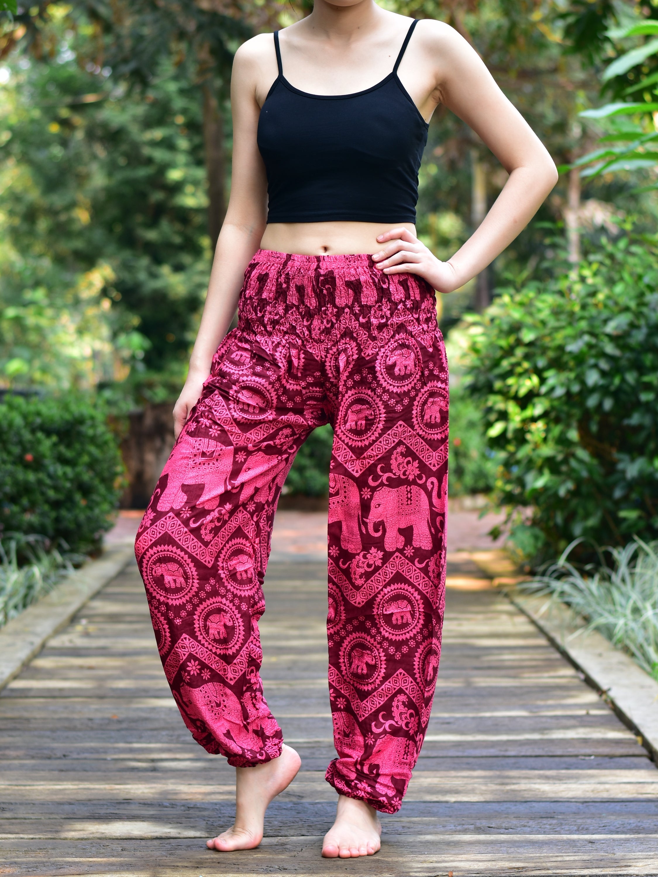 Bohotusk Kids Red Pink Elephant Harem Trousers featuring a vibrant elephant design, elasticated waist, and ankles, made from soft rayon.