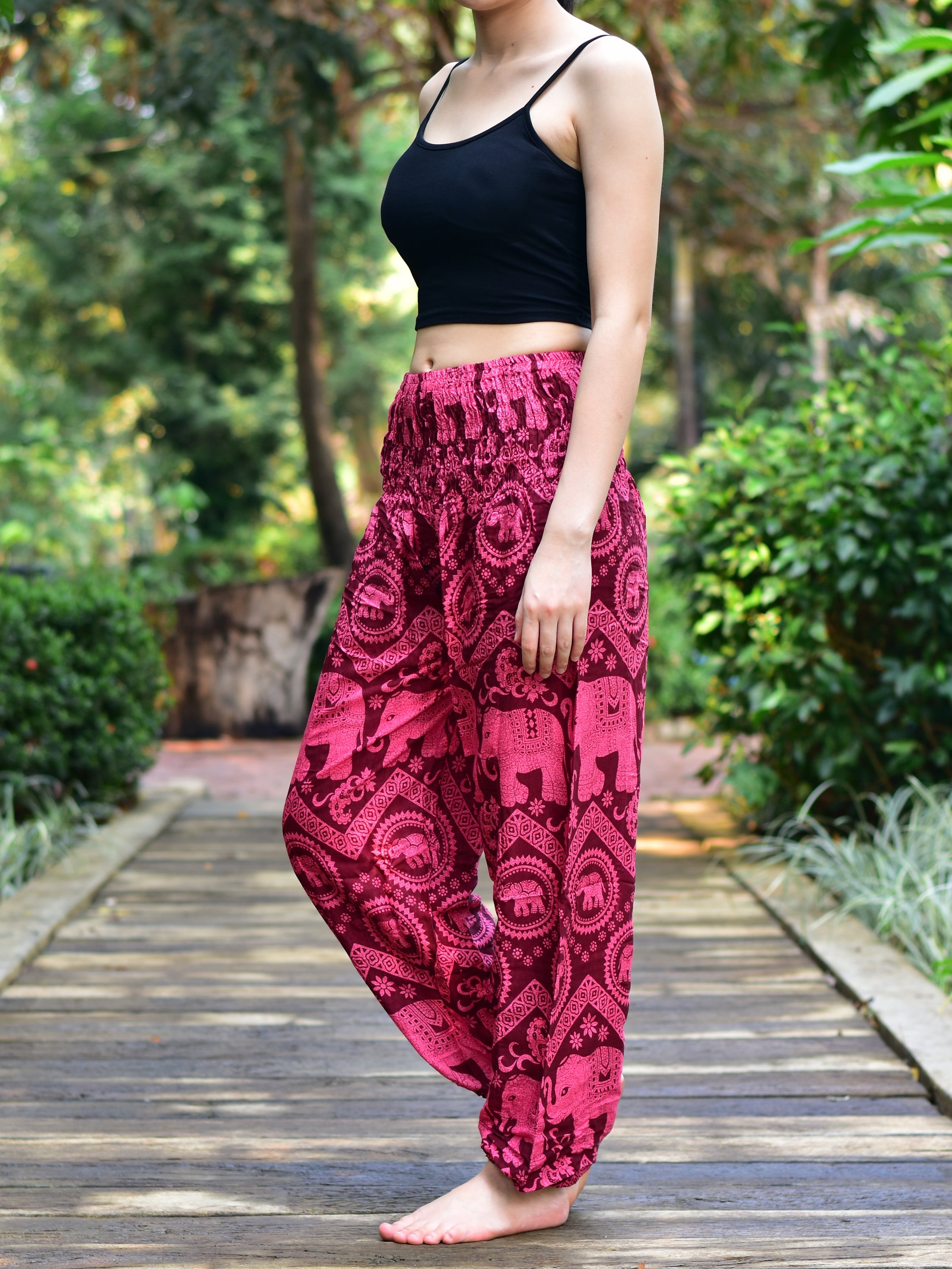 Bohotusk Kids Red Pink Elephant Harem Trousers featuring a vibrant elephant design, elasticated waist, and ankles, made from soft rayon.