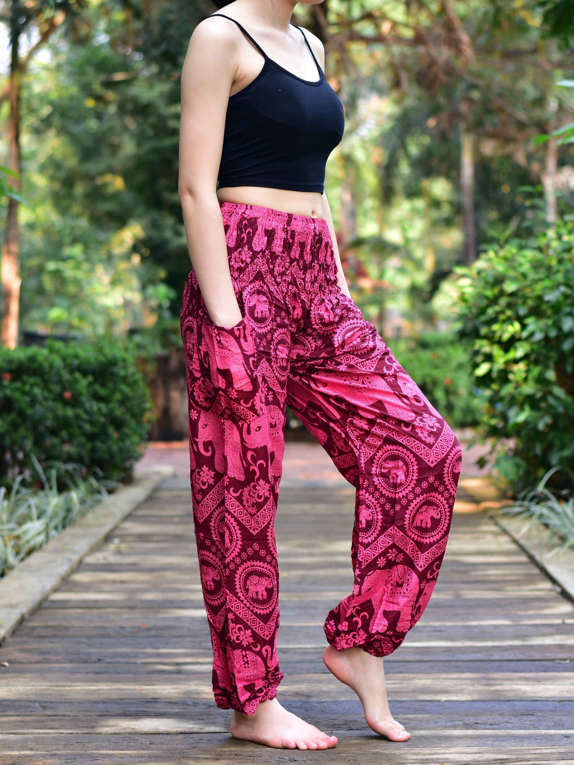 Bohotusk Kids Red Pink Elephant Harem Trousers featuring a vibrant elephant design, elasticated waist, and ankles, made from soft rayon.