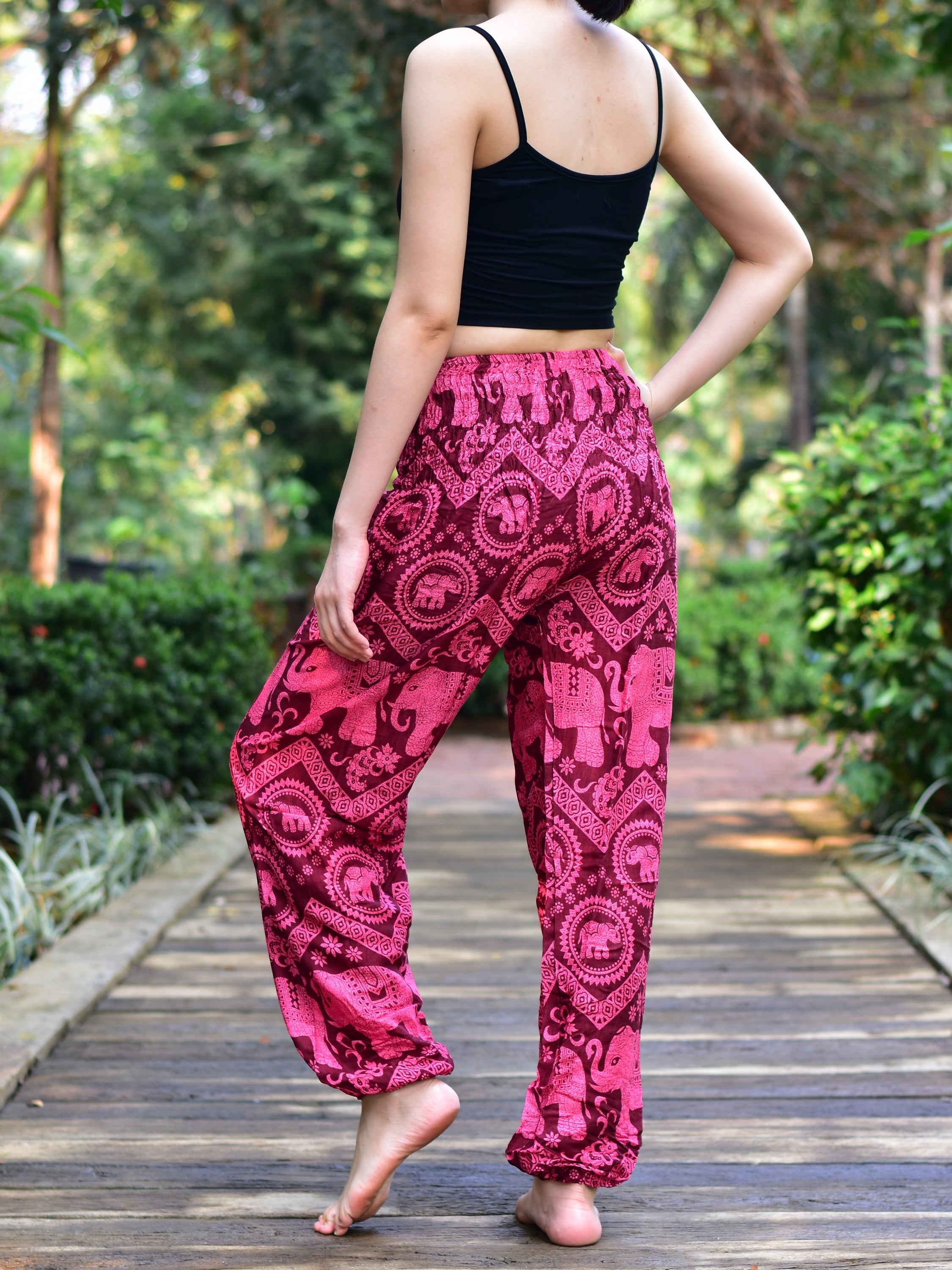 Bohotusk Kids Red Pink Elephant Harem Trousers featuring a vibrant elephant design, elasticated waist, and ankles, made from soft rayon.