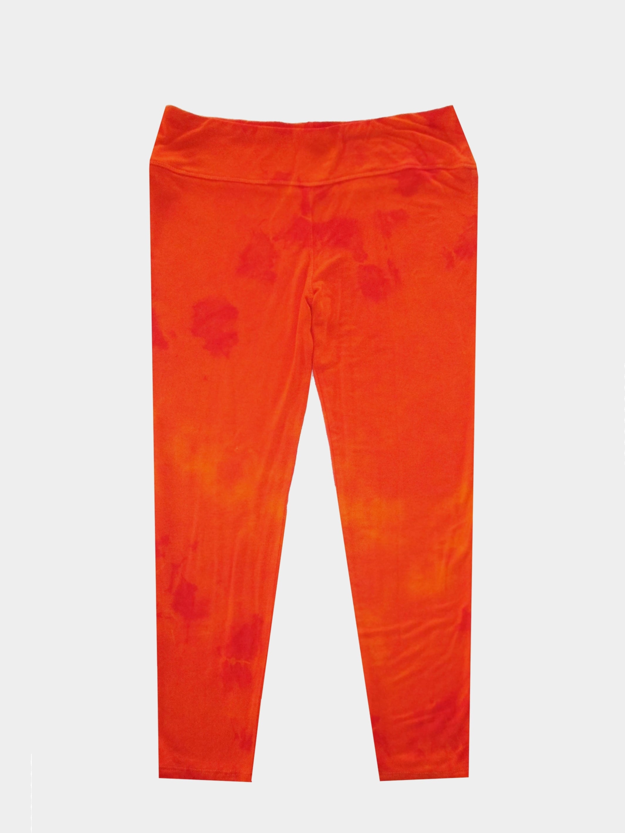 Bright orange tie dye capri leggings made from soft cotton knit with an elastic waistband, perfect for summer wear.