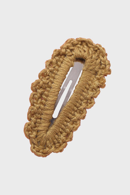 A beautifully handcrafted crochet hair clip, featuring intricate patterns and vibrant colors, perfect for adding a cute touch to any hairstyle.