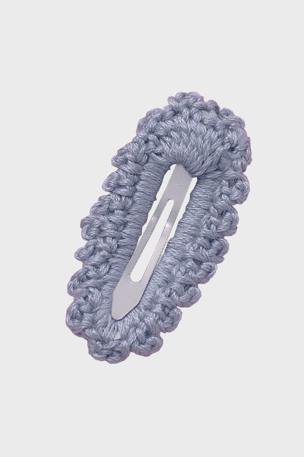 A beautifully handcrafted crochet hair clip, featuring intricate patterns and vibrant colors, perfect for adding a cute touch to any hairstyle.