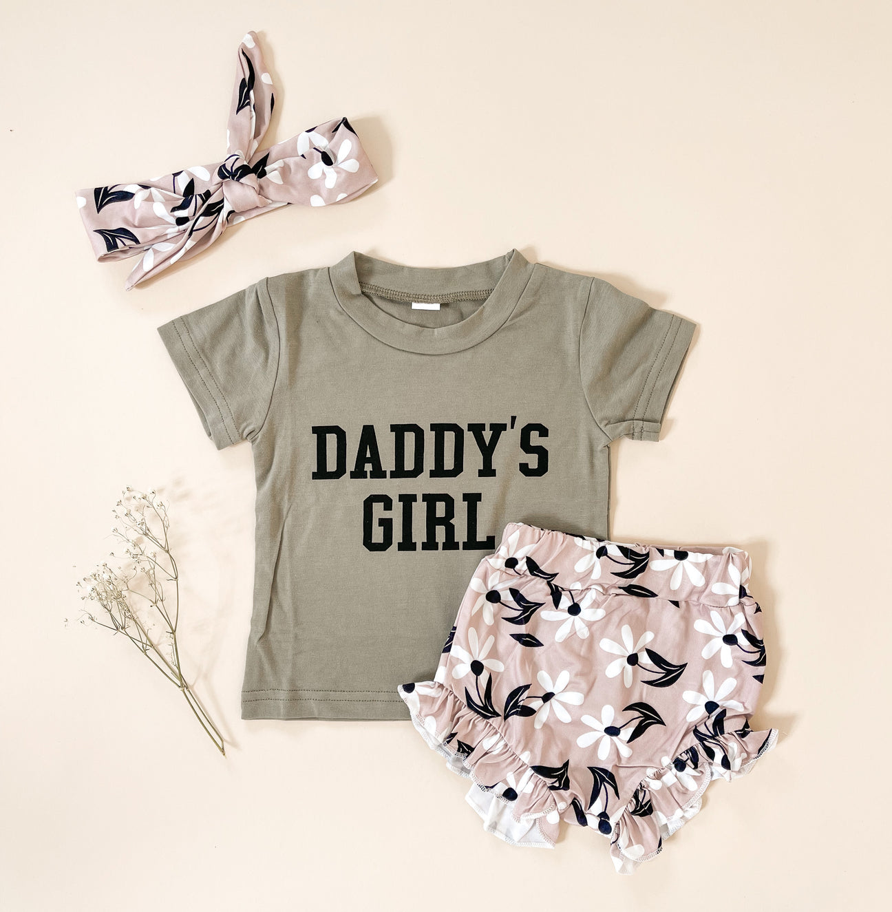 A cute two-piece Daddy's Girl Outfit Set made of soft, lightweight cotton, featuring a stylish top and matching bottoms.