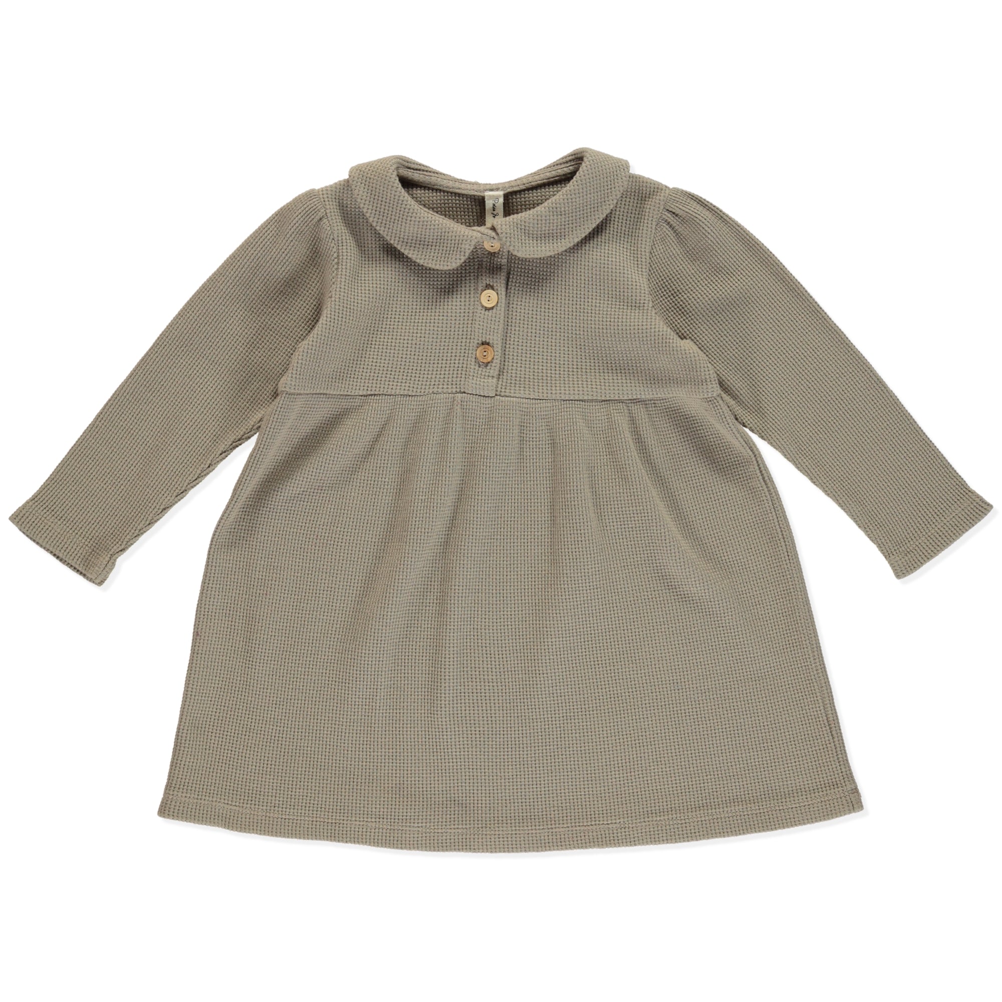 Dress Betty Coffee, a casual baby girl dress with olive wooden buttons, puff sleeves, and round collar in coffee color made from organic cotton.