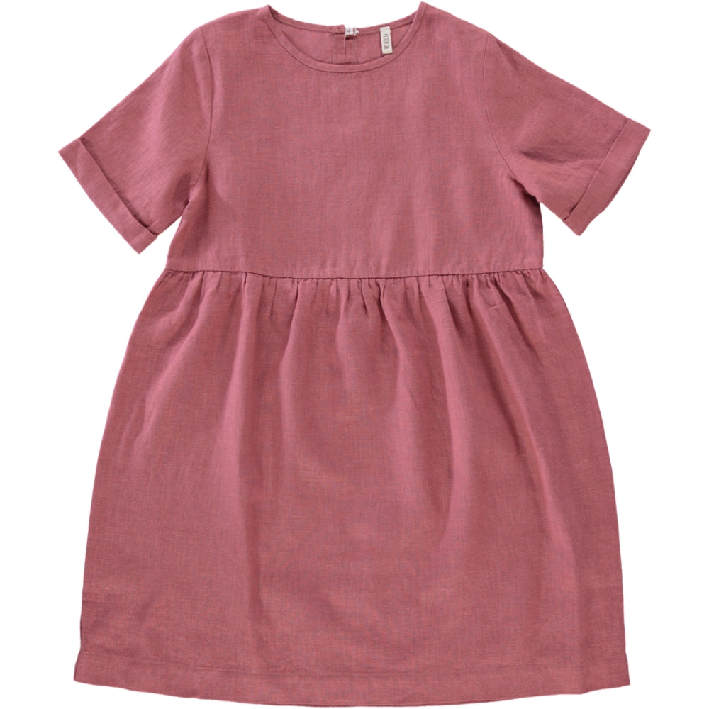 A soft linen dress in rose and blue celeste colors, featuring a loose fit and an olive wood button closure on the back.