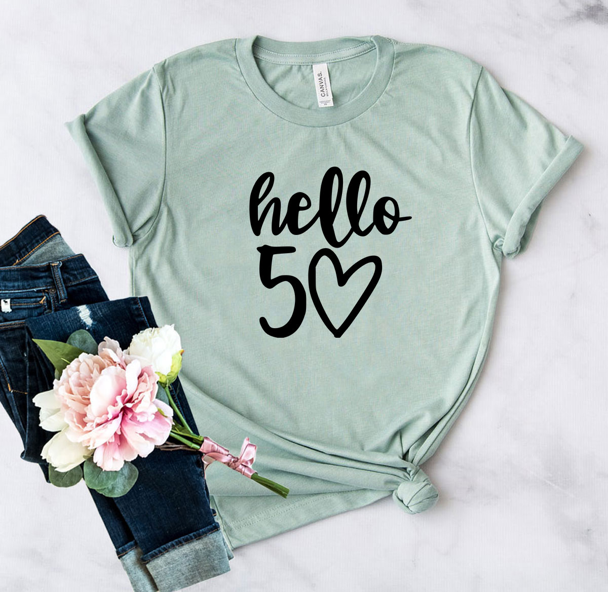 DT0264 Hello 50 Shirt in various colors, showcasing its soft fabric and stylish design.