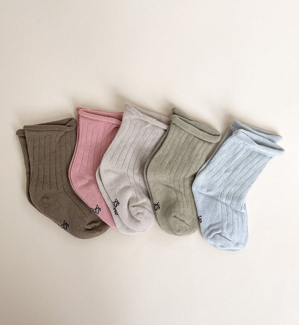 A pair of cozy Earthy Tones Baby Socks in soft cotton, featuring five earthy colors suitable for infants and toddlers.