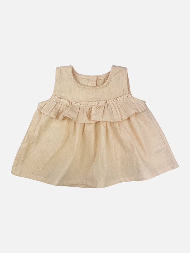 Eloise 2 pc set featuring a pale peach tank top with ruffles and matching bloomer shorts, made of textured cotton fabric.