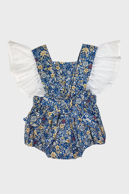 Everly Flutter Bow Onesie in blue floral print with ruffled sleeves and a large bow at the back.