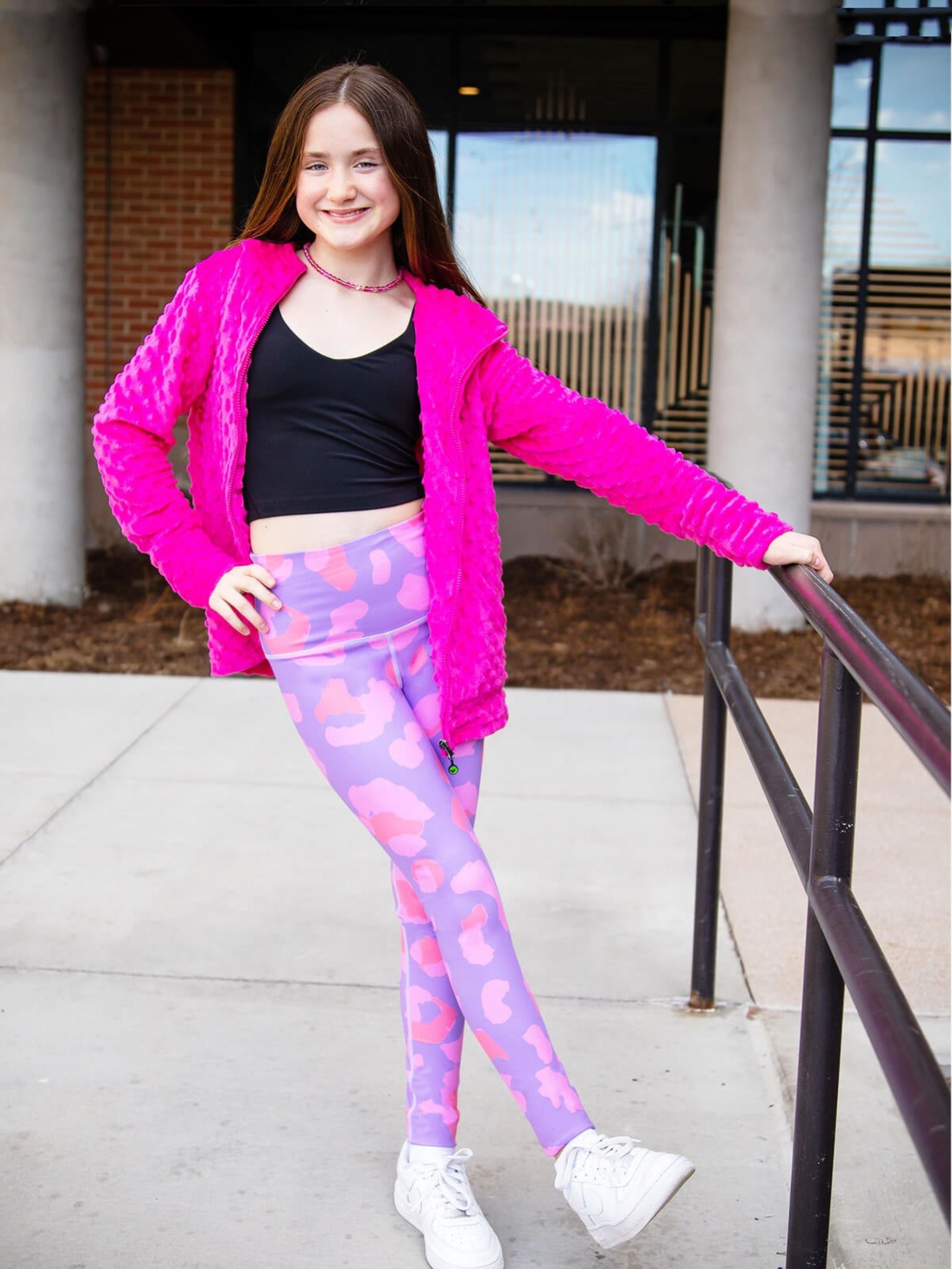 Bright fuchsia minky bubble hoodie paired with printed Rimi active leggings, showcasing a stylish activewear set for kids.