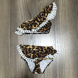 Girls 2 piece leopard print bikini with one shoulder ruffle design, perfect for beach wear.