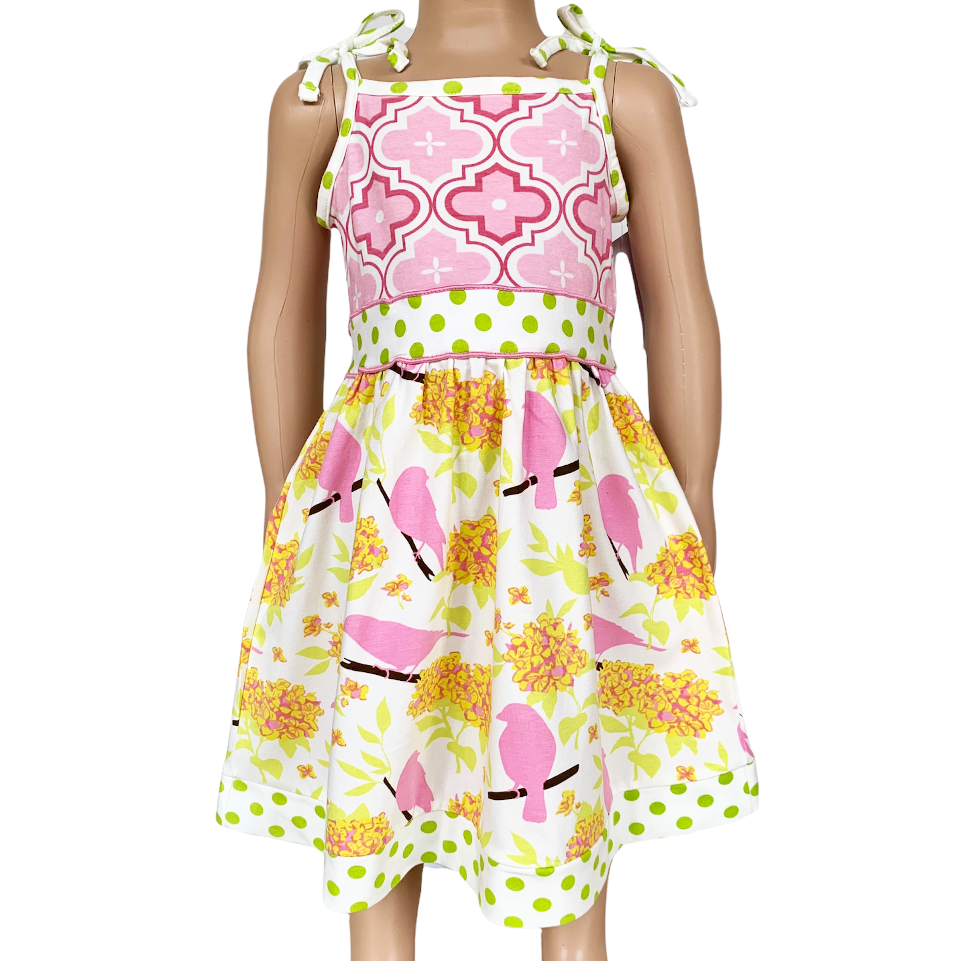 Girls Easter dress featuring spring birds and pink Arabesque print with polka dot sash and bow.