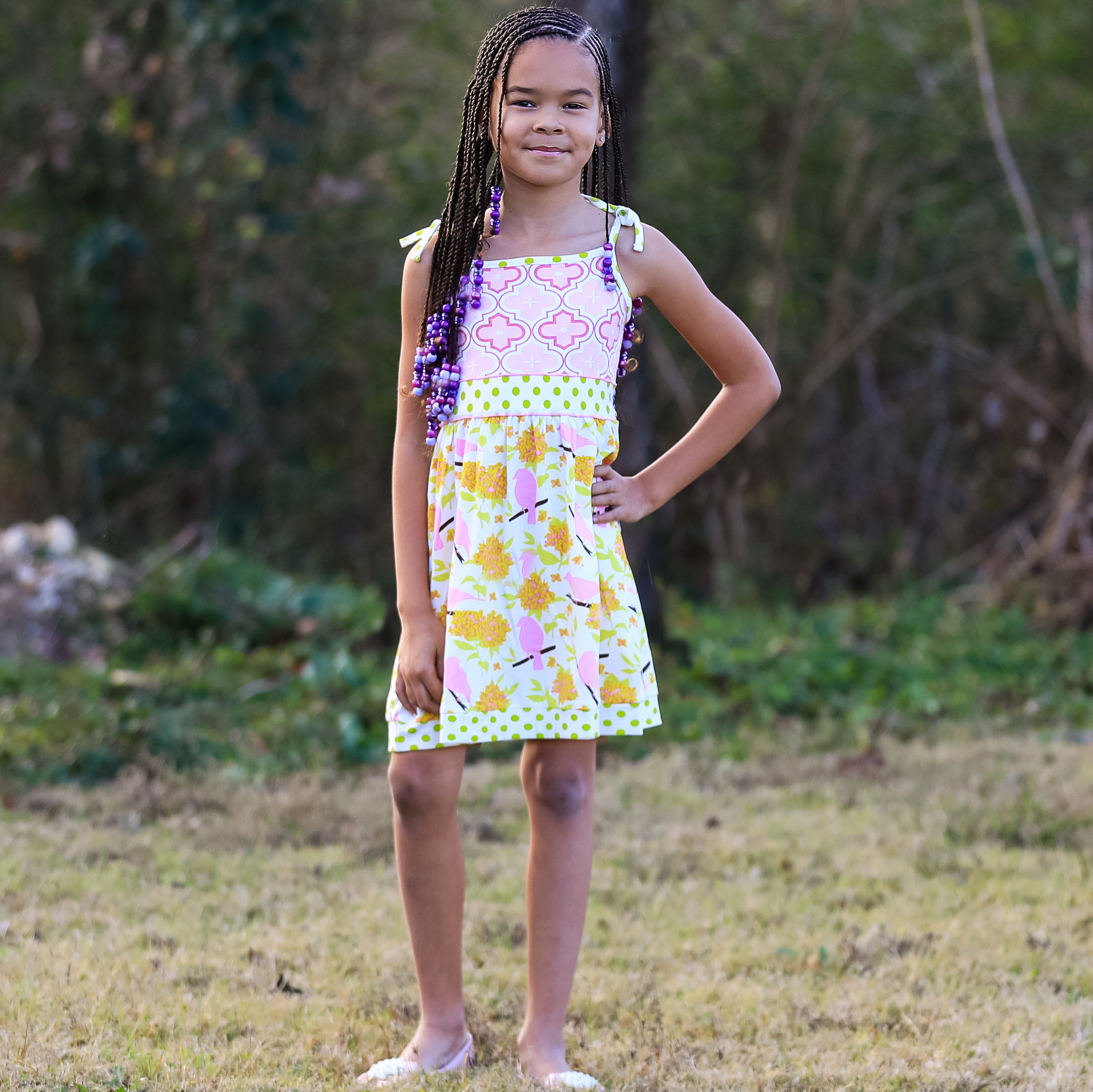 Girls Easter dress featuring spring birds and pink Arabesque print with polka dot sash and bow.