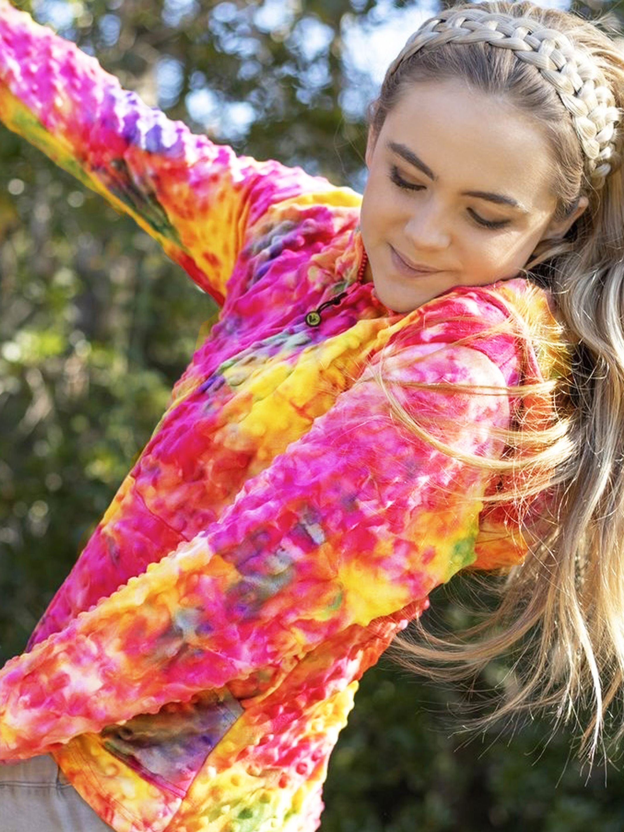 Bright Rainbow Tie Dye Girls Hoodie by Limeapple, featuring vibrant colors and a cozy design, perfect for layering and lounging.