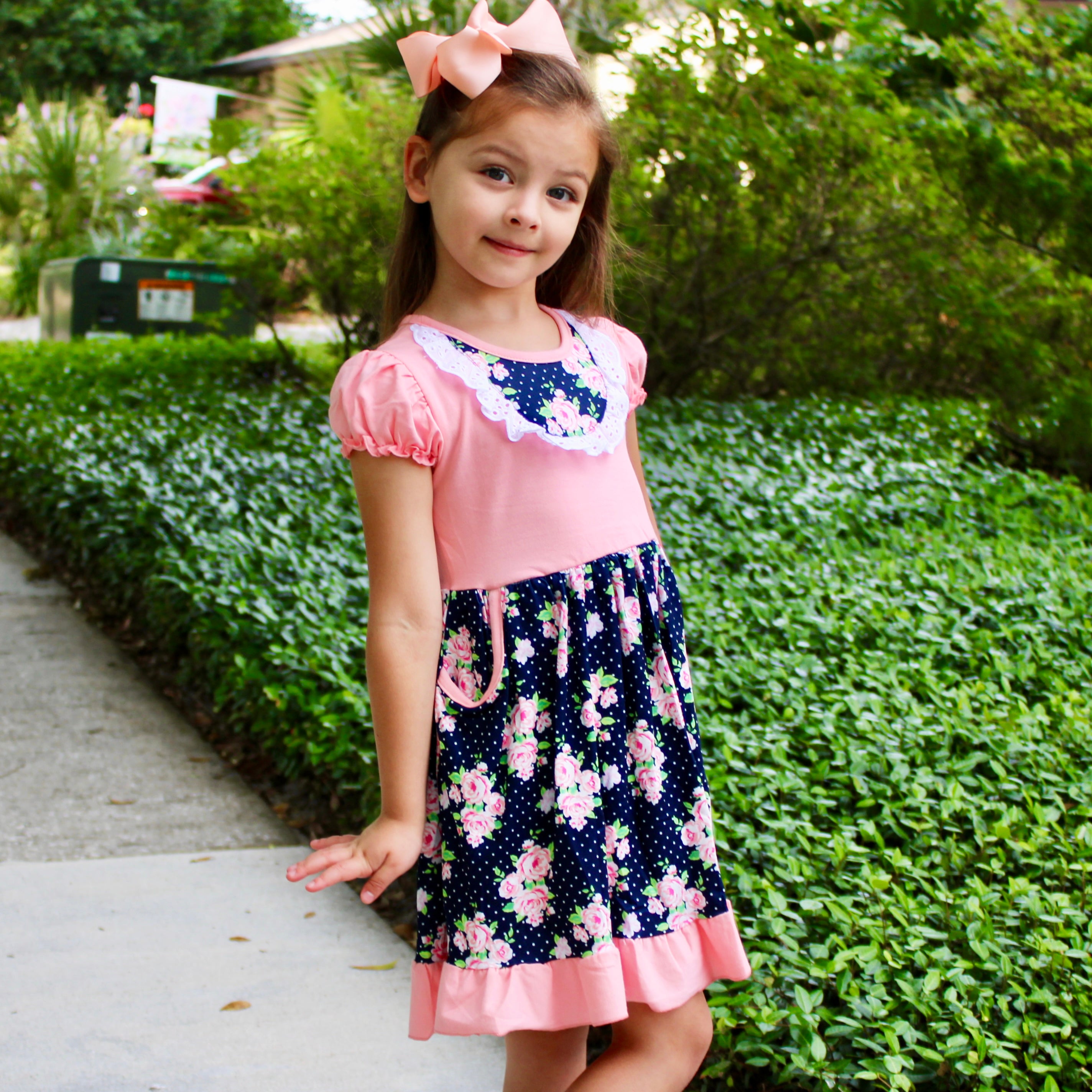 Girls Pink and Blue Floral Bouquet Dress with Ruffles and Pockets, perfect for parties.