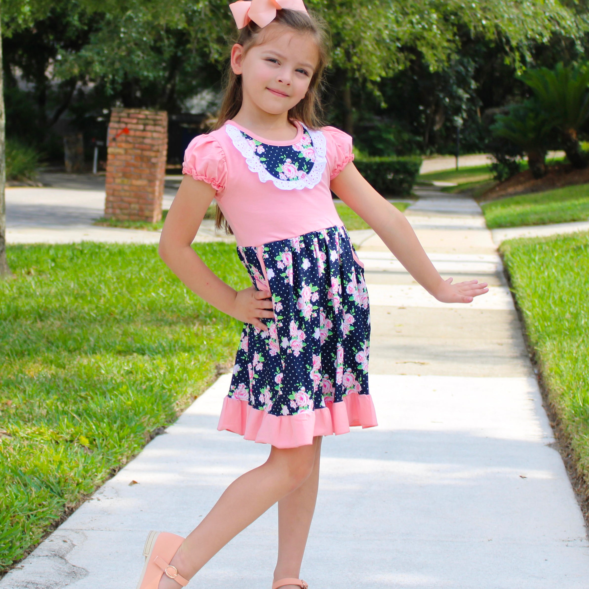 Girls Pink and Blue Floral Bouquet Dress with Ruffles and Pockets, perfect for parties.