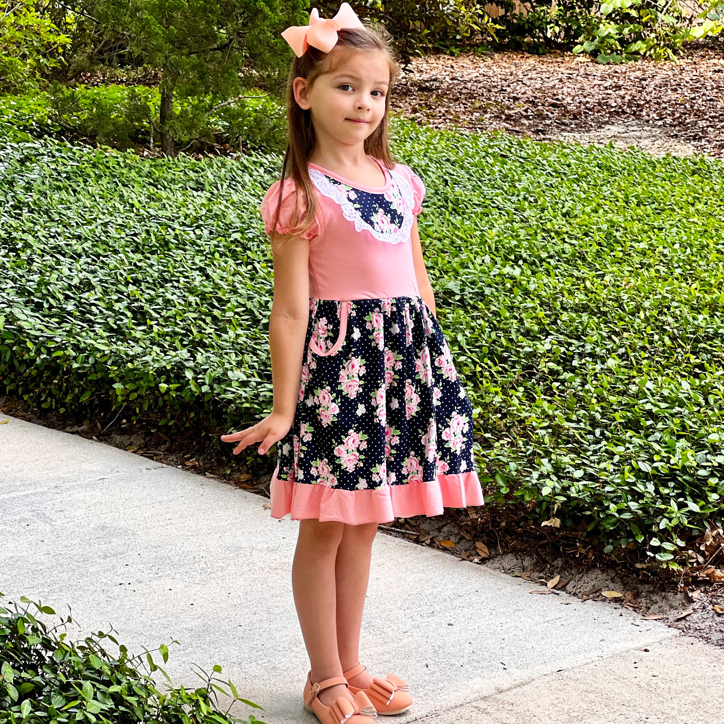 Girls Pink and Blue Floral Bouquet Dress with Ruffles and Pockets, perfect for parties.